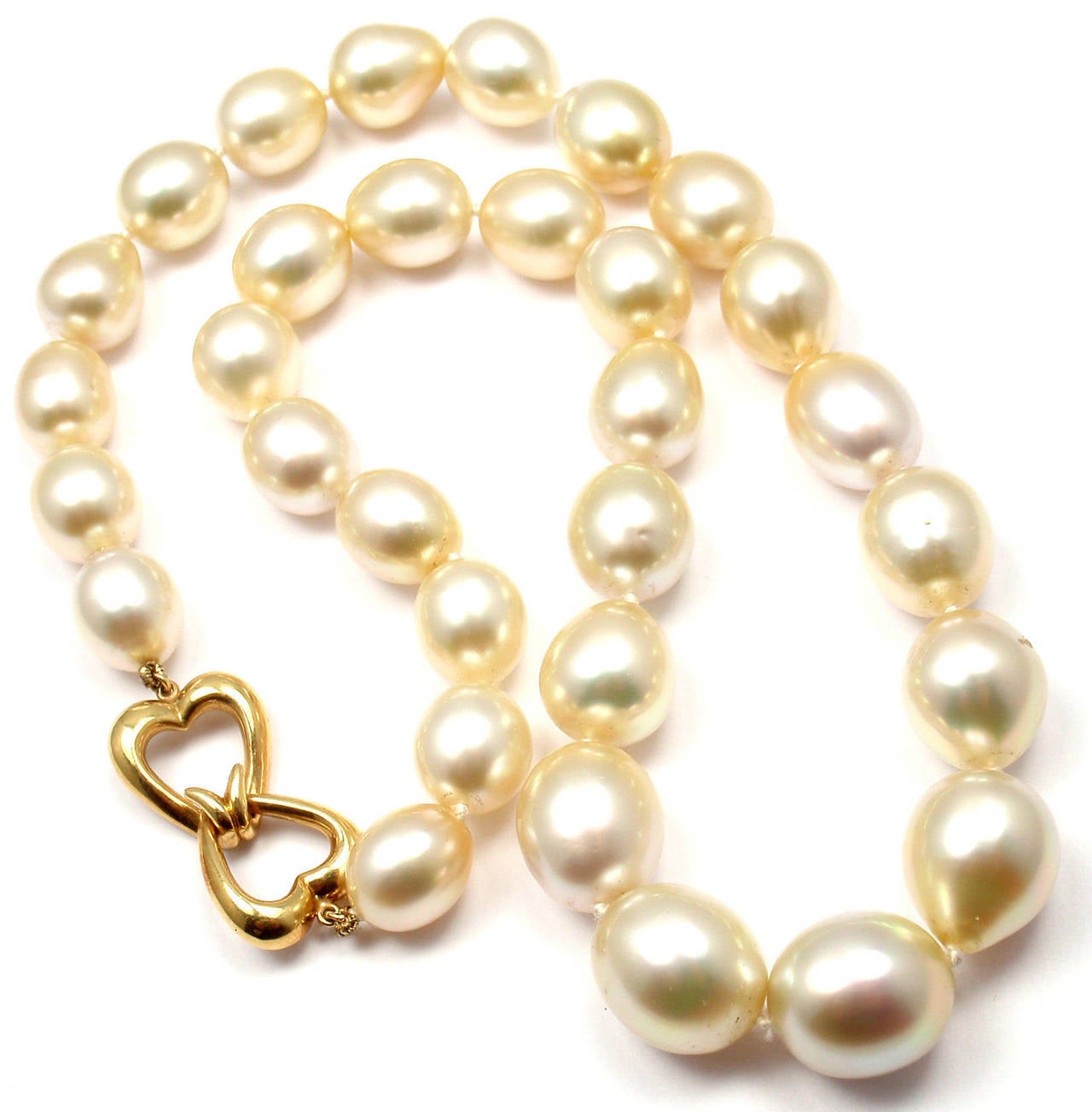 18k Yellow Gold Golden Tahitian Pearl Necklace by Andrew Clunn. 
With 31 total Golden Tahitian pearls from 13mm to 11mm.

Details: 
Necklace Length: 18