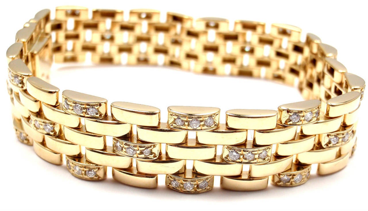 18k Yellow Gold 5 Row Maillon Panthere Diamond Link Bracelet by Cartier. 
With104 round brilliant cut diamonds VVS1 clarity, E color total weight 
approximately 2.60

Details:
Length: 7