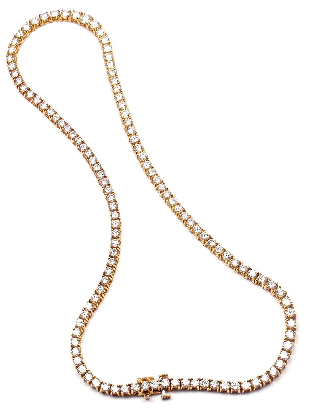 18k Yellow Gold Diamond Tennis Necklace by Tiffany & Co.
With 115 round brilliant cut diamonds VVS-VS clarity,
F-G color 
Total weight approximately 12.38ct
This necklace comes with Tiffany & Co valuation from 1994 for $43,500. 
Today's