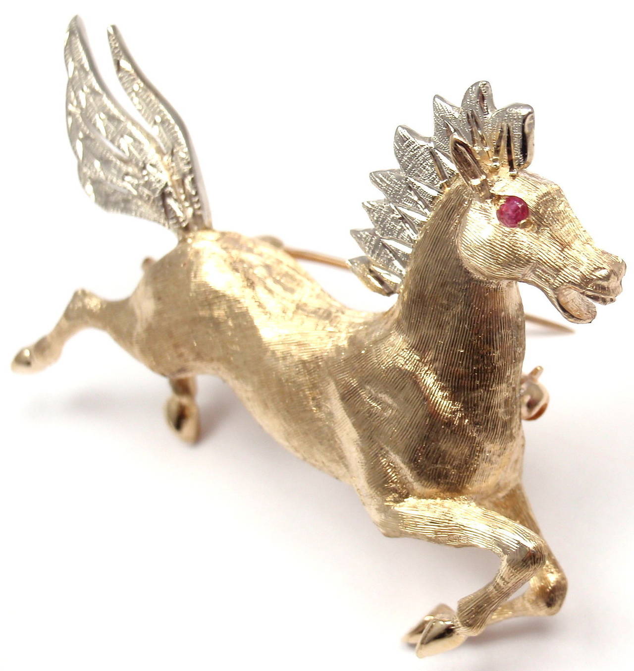 14k Yellow & White Gold Ruby Horse Brooch Pin by Tiffany & Co. 
With 1 round ruby in the eye

Details: 
Measurements: 2