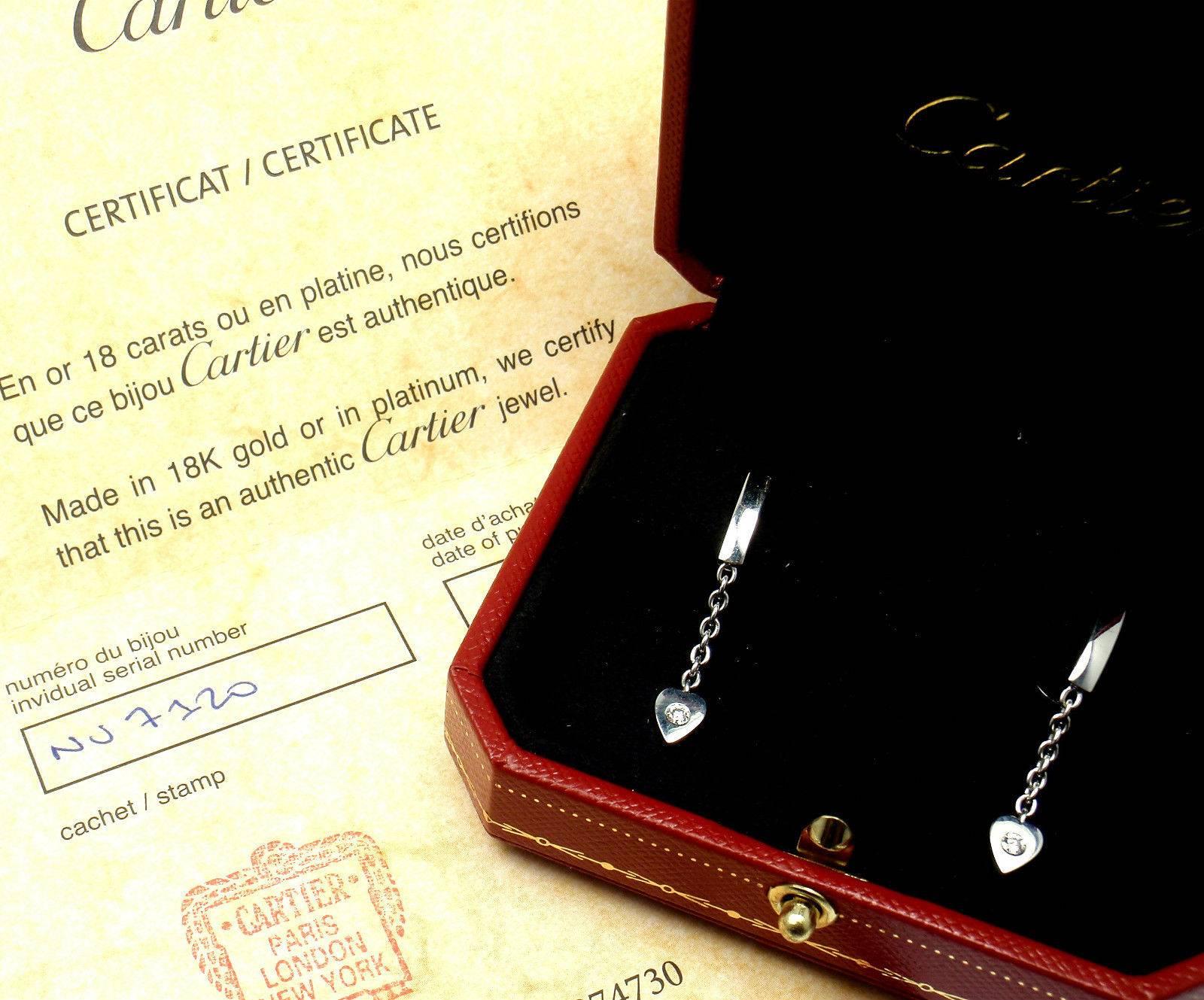 18k White Gold Diamond Heart Drop Dangle Earrings by Cartier.
With 2 Round brilliant cut diamonds total weight approx .15ct.
Diamonds VVS1 clarity, E color
These earrings are in mint condition and come with original Cartier box and Cartier