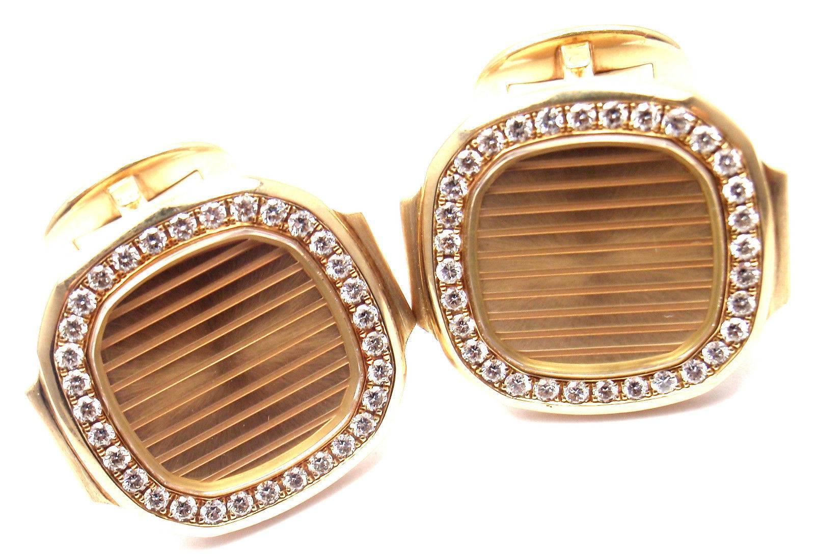 18k Yellow Gold Diamond Nautilus Cufflinks by Patek Philippe.
With 66 round brilliant cut diamonds VS1 clarity, G color total weight approx. 1ct

Details:
Measurements: 20mm x 22mm x 22mm
Weight: 30 grams
Stamped Hallmarks: Patek-Phillippe 750