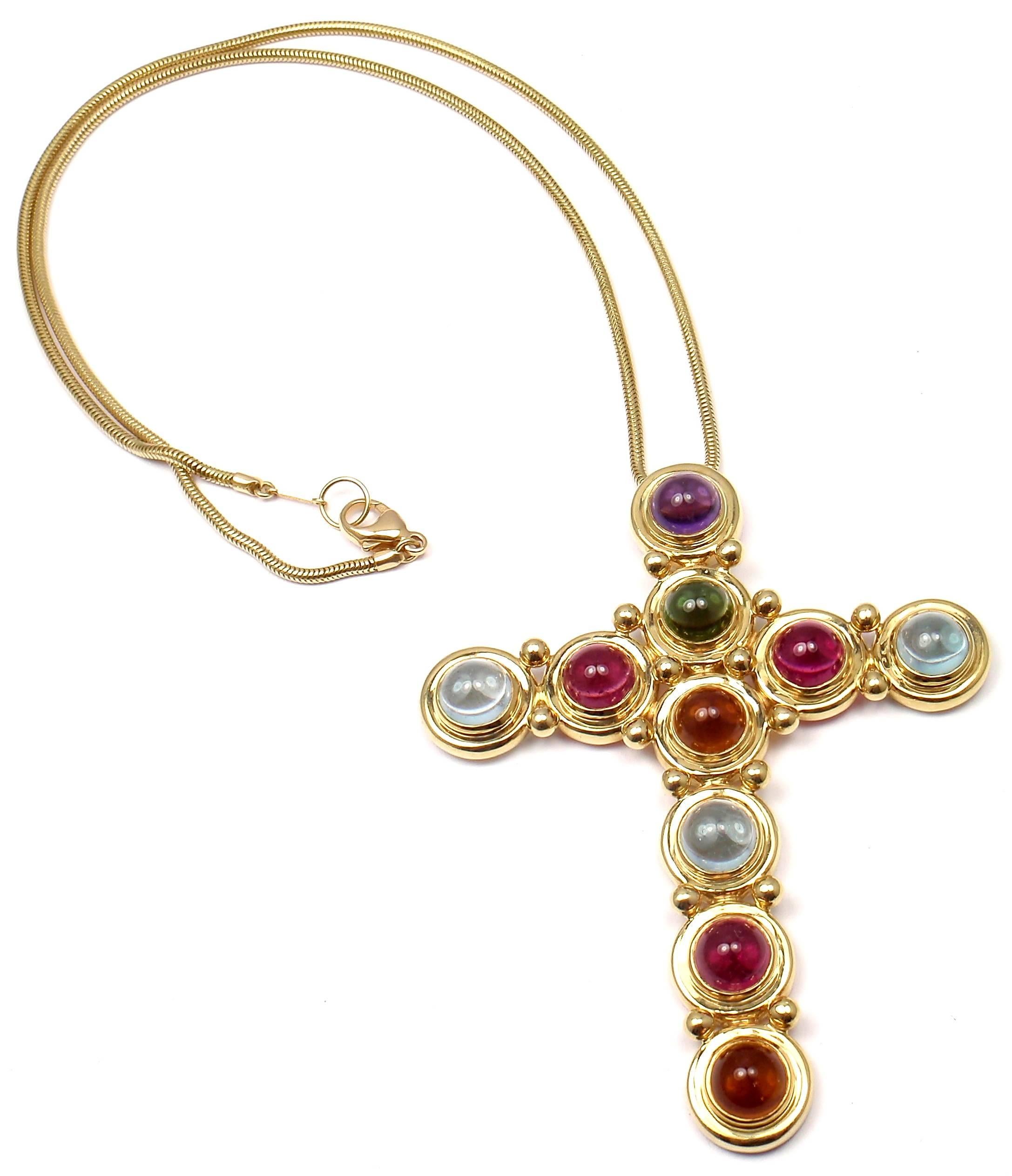 18k Yellow Gold Aquamarine Citrine Tourmaline Large Cross Necklace by Paloma Picasso for Tiffany & Co. 
With 3 round cabochon aquamarines 8mm each
3 round cabochon pink tourmalines 8mm each
1 round cabochon green tourmaline 8mm
2 round cabochon