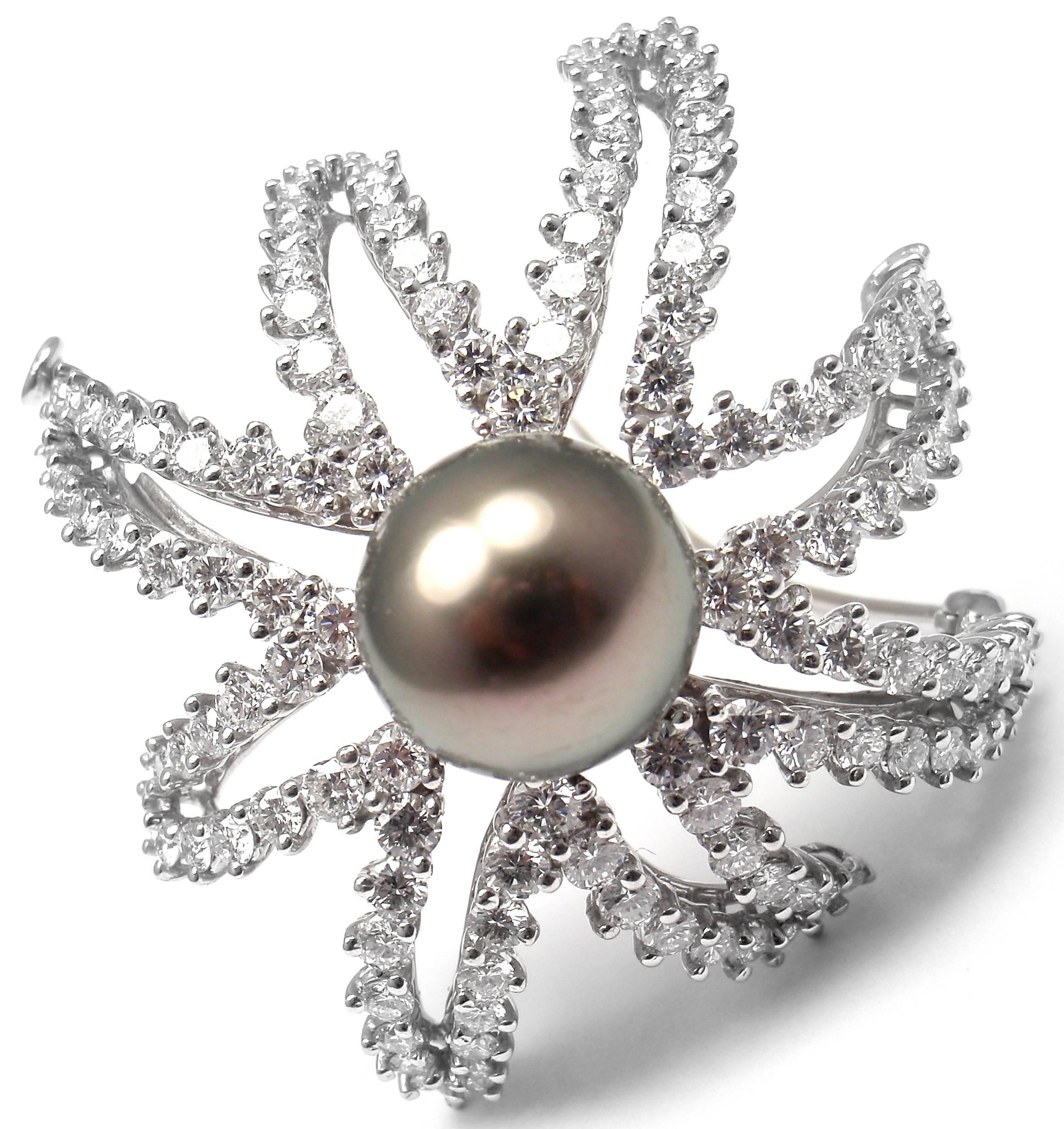 Platinum Diamond and Tahitian Pearl Fireworks Brooch Pin by Tiffany & Co.
With Round brilliant cut diamonds VS1 clarity, E color total weight approx. 4ct
1 large grey Tahitian pearl 11mm

Details: 
Measurements: 40mm x 38mm
Weight: 21.9