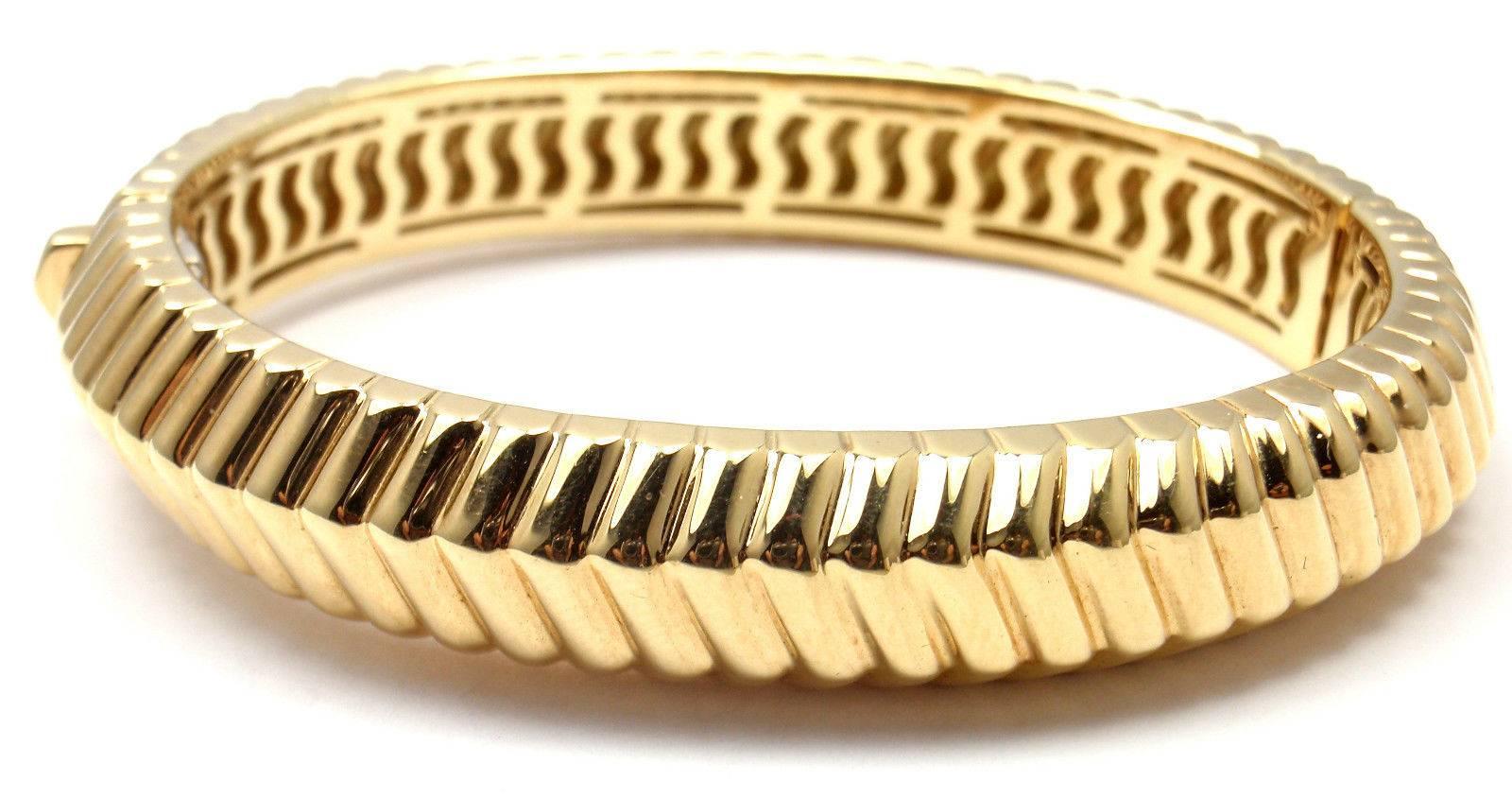 18k Yellow Gold Chevron Heavy Bangle Bracelet by Tiffany & Co.   

Details:  
Length 7