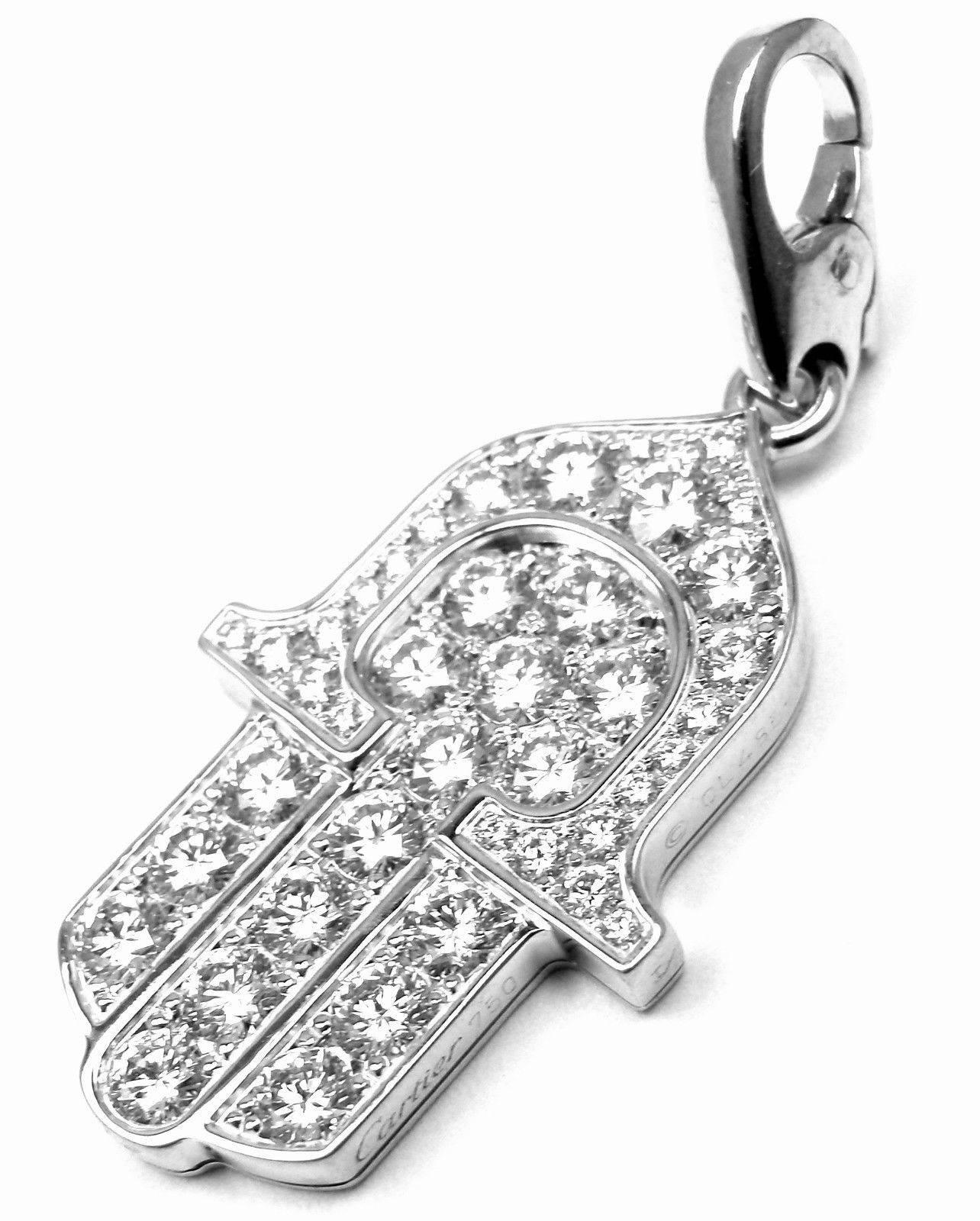 18k White Gold Diamond Hamsa Hand or Hand of Fatima Charm Pendant by Cartier. 
With 40 round brilliant cut diamonds VVS1 clarity, E color total weight approx. 1.5ct
This pendant comes with Cartier box.

Details:  
Weight: 6.9 grams