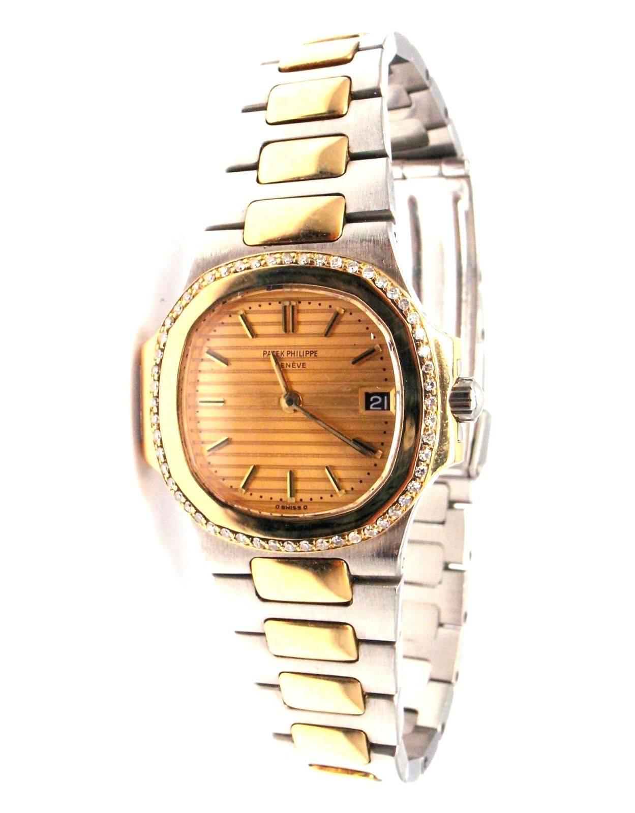 Patek Philippe Ladies 18k yellow gold Stainless Steel diamond Nautilus wristwatch. 
With 58 round brilliant cut diamonds VS1 clarity, G color.

Details: 
Case Dimensions: 27mm x 29mm
Band: Original Patek Philippe 18k Yellow Solid Gold And