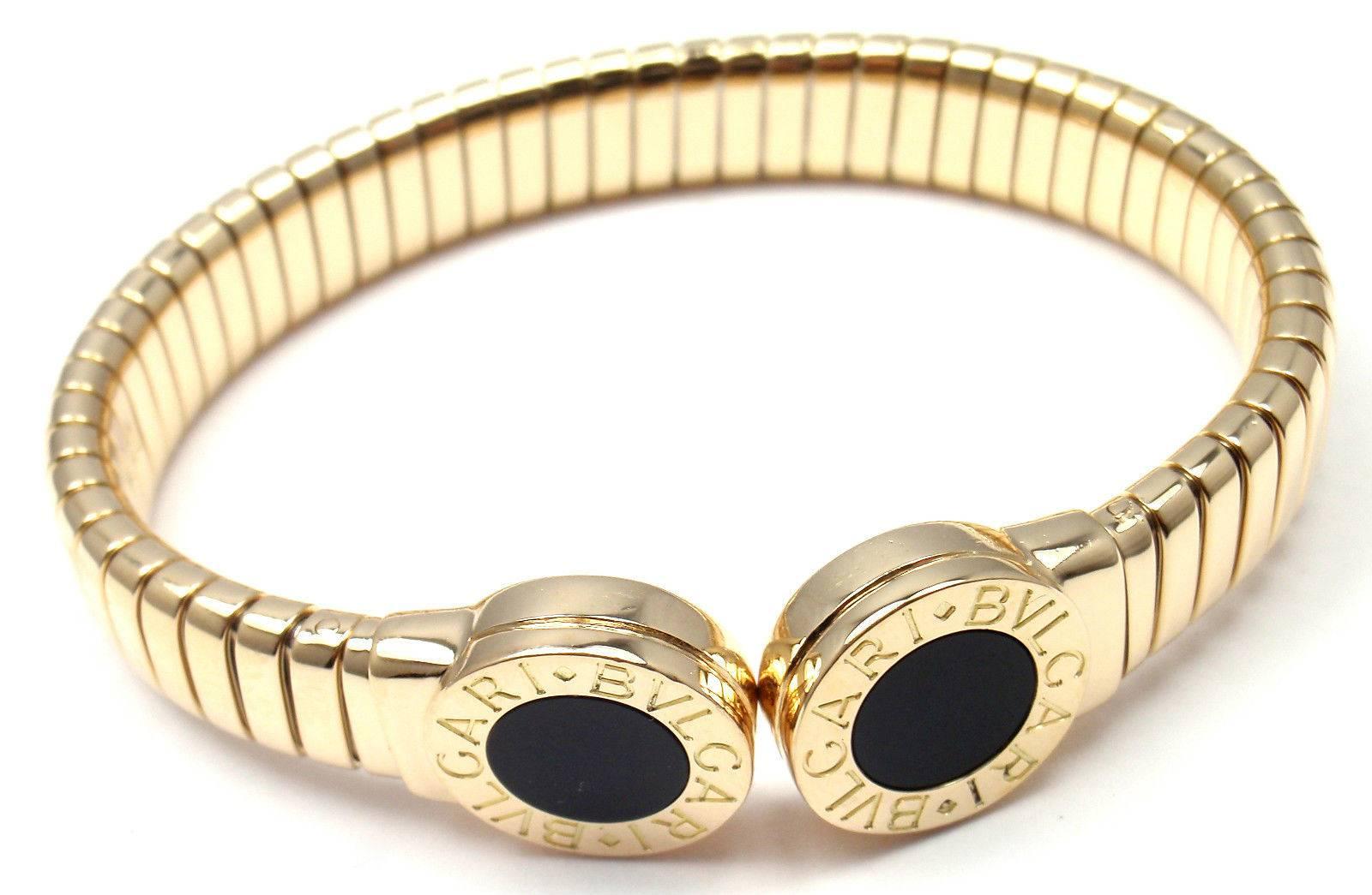18k Yellow Gold Tubogas Black Onyx Bangle Bracelet by Bulgari. 
With 2 round black onyx stones 8mm each.

Details: 
Length: 6.5