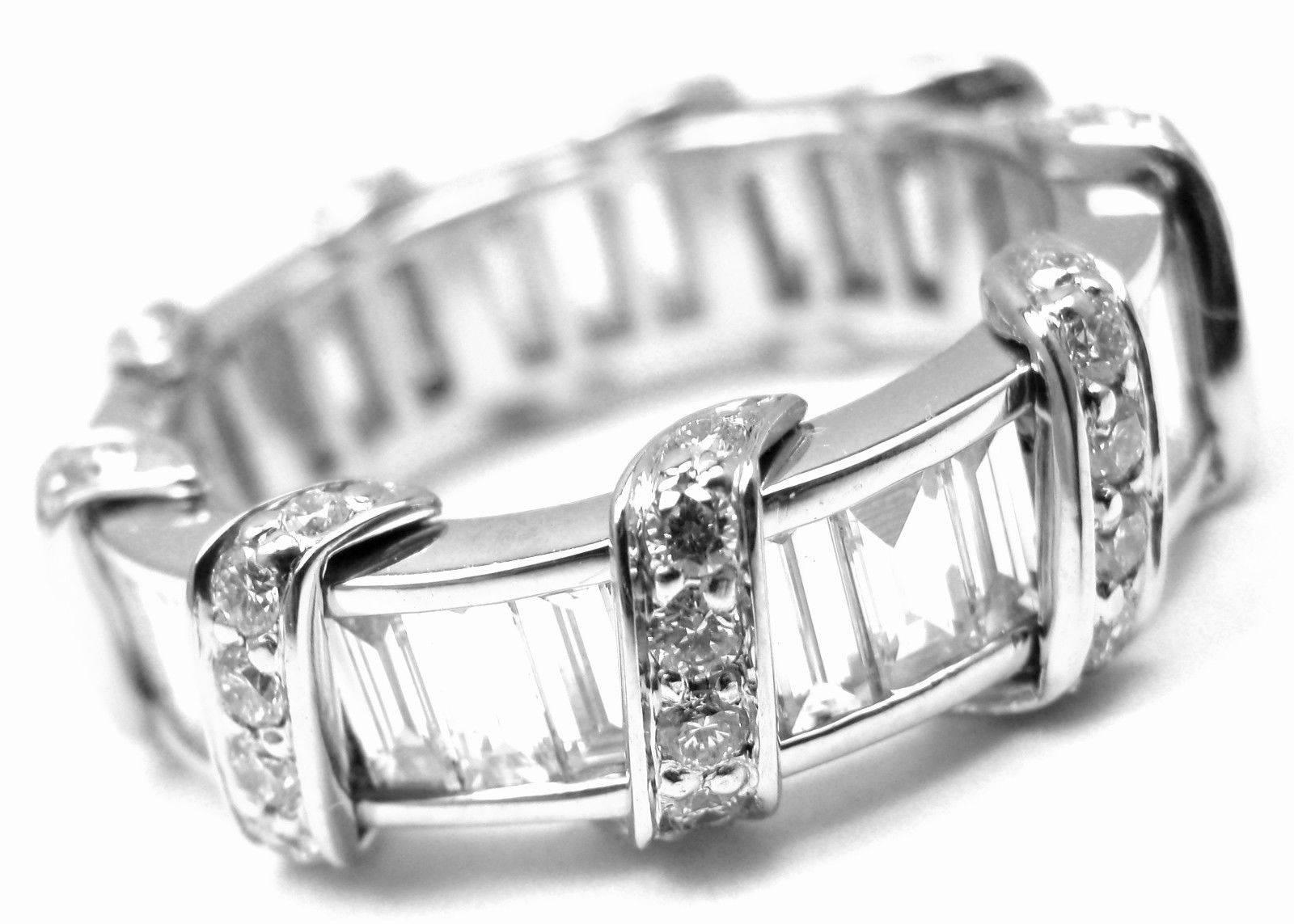 Platinum Diamond Wide Eternity Band Ring by Verdura.  
With 181 round & baguette cut diamonds E color, VVS1 clarity
Details:  
Size: 6.5
Weight: 9.5 grams 
Width: 7mm
Stamped Hallmarks: VERDURA PT.

*Free Shipping within the United States* 