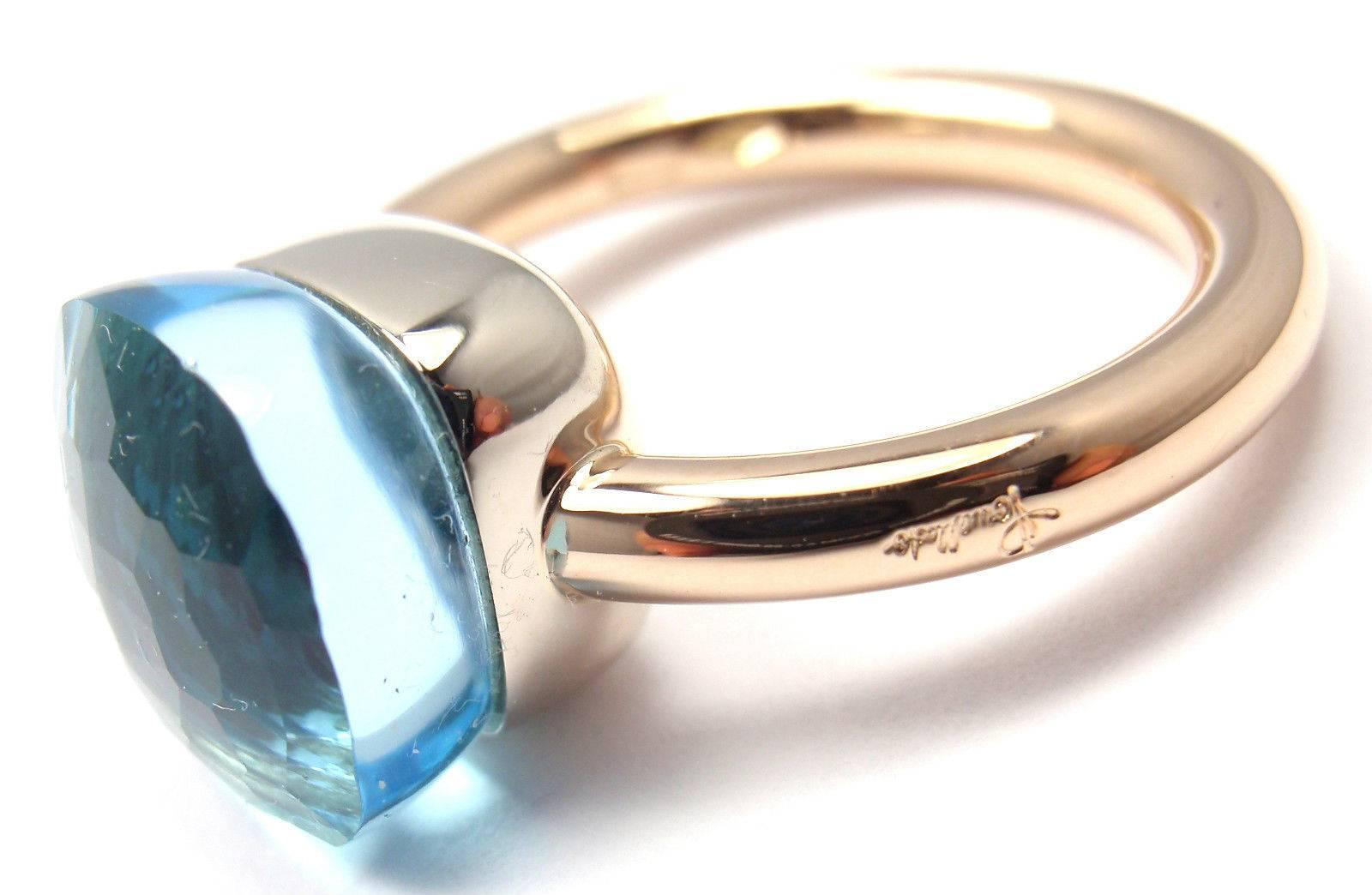 18k Rose And White Gold Nudo Blue Topaz Ring by Pomellato. 
This ring comes with an original Pomellato box and a certificate. 
With 1 blue topaz 11mm x 11mm

Details:
Size: 5
Width: 11mm
Weight: 7.9 grams
Stamped Hallmarks: Pomellato 750