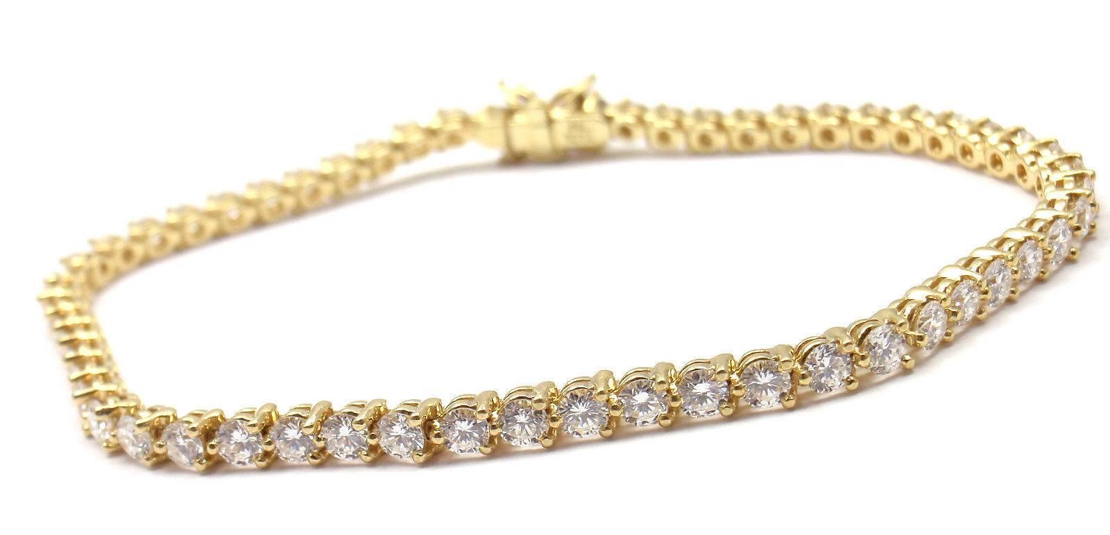 18k Yellow Gold Diamond Line Bracelet by Tiffany & Co from Victoria collection.
With 4 Marque brilliant cut diamonds VS1 clarity, E color total weight approx. .20ct
56 round brilliant cut diamonds VS1 clarity, E color total weight approx.
