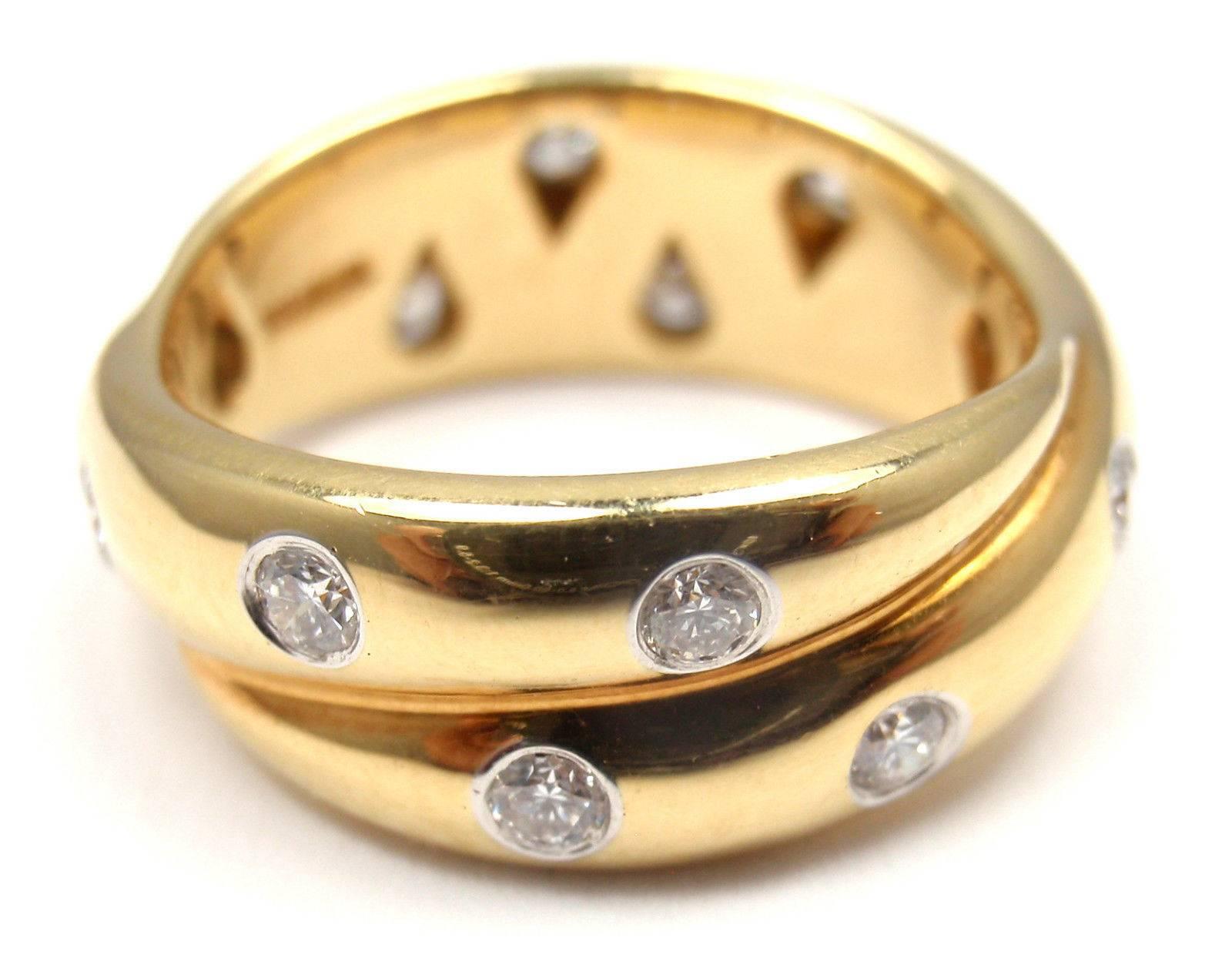 Tiffany & Co. Etoile 18k Yellow Gold And Platinum Diamond Twist Band Ring.  With o12 Round Billiant Cud Diamonds VS1 clarity, G color, Total weight Approx .31ct
Measurements:  
Ring Size: 5
Weight: 7.6 grams 
Width: 8mm
Stamped Hallmarks: