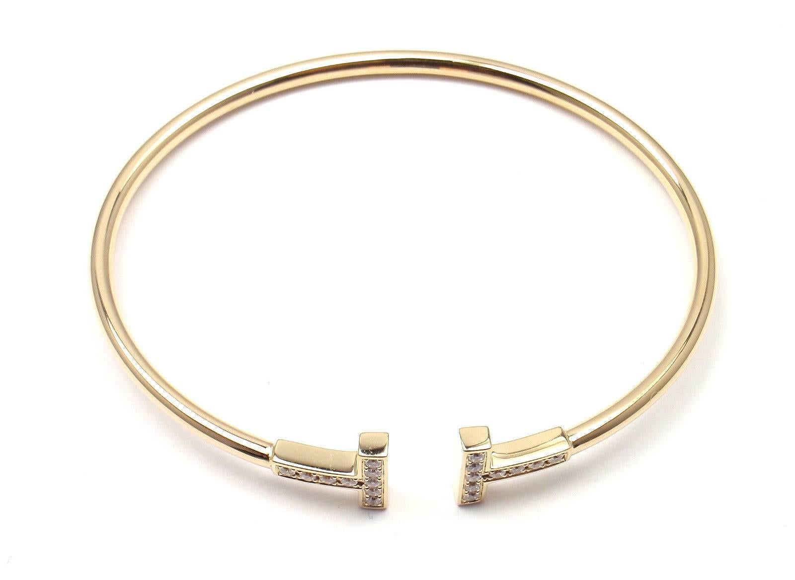 18k Yellow Gold Diamond Tiffany T Bangle Bracelet by Tiffany & Co. 
With 18 round brilliant cut diamonds VS1 clarity, E color total weight approx. .22ct

Details: 
Weight: 7.9 grams
Length: 6.25