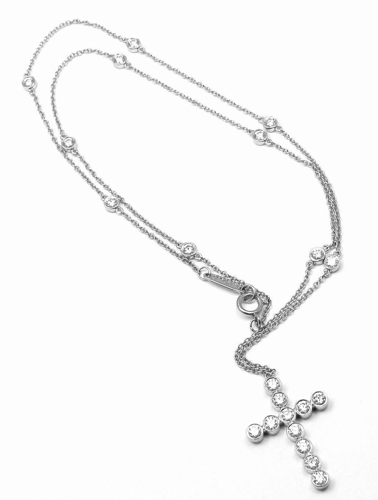 Platinum Diamond Jazz Cross Pendant Necklace by Tiffany & Co.
With 21 round brilliant cut diamonds  
t/w = 1.25ct.  VS1 clarity E-G color

Details:
Measurements: Necklace Length: 16