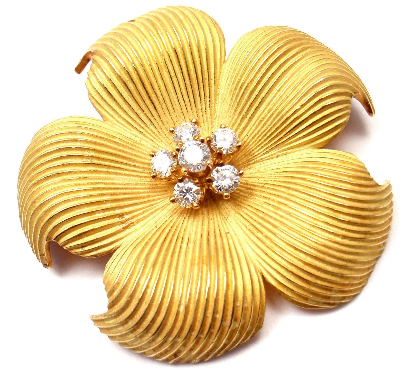 18k Yellow Gold Diamond Dogwood Pin Brooch by Tiffany & Co. 
With 6 round brilliant cut diamonds VS1 clarity, G color total weight approx. .65ct

Details: 
Measurements: 40mm x 40mm
Weight: 23.4 grams
Stamped Hallmarks: Tiffany & Co 750