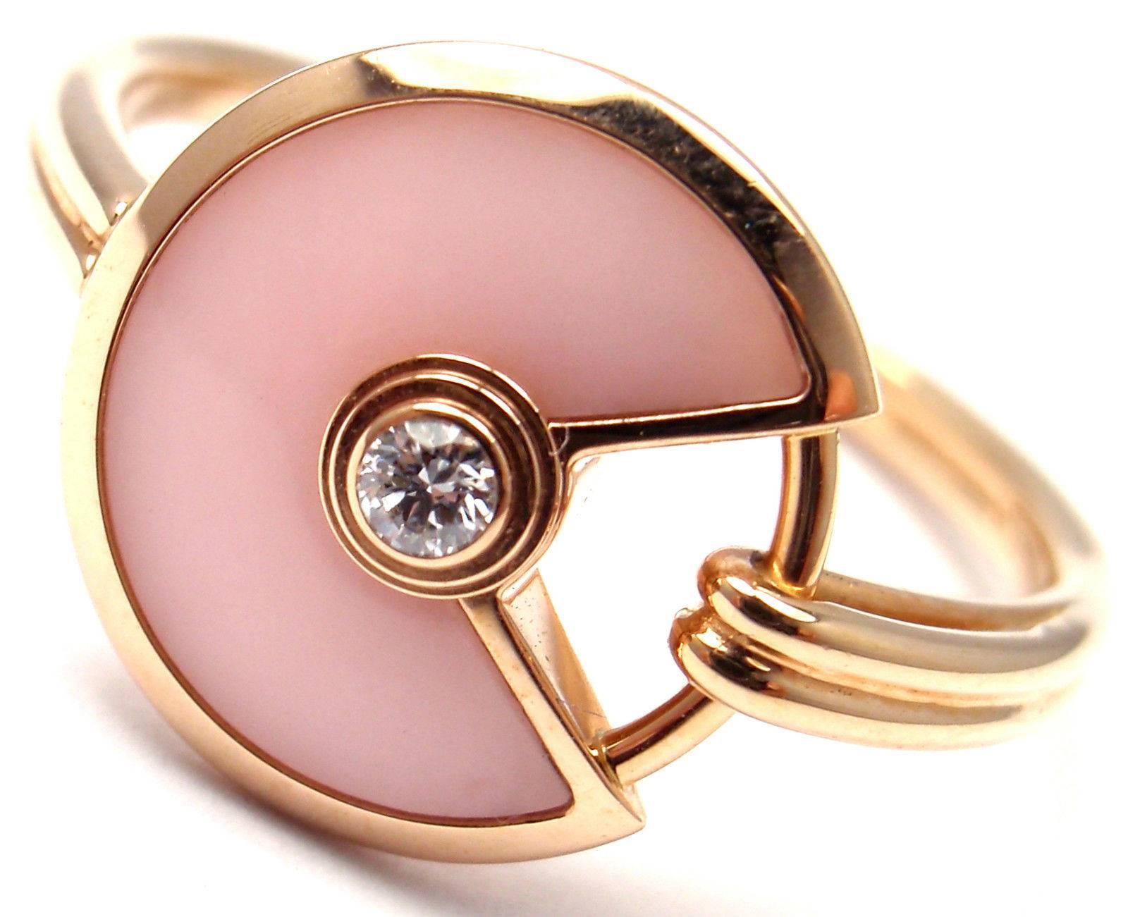 18k Rose Gold Diamond And Pink Opal Amulette de Cartier Ring by Cartier. 
With 1 Round brilliant cut diamonds VS1 clarity, G color total weight approximately .02ct And Pink Opal
This ring comes with Cartier box.

Details: 
Size:  European 55,