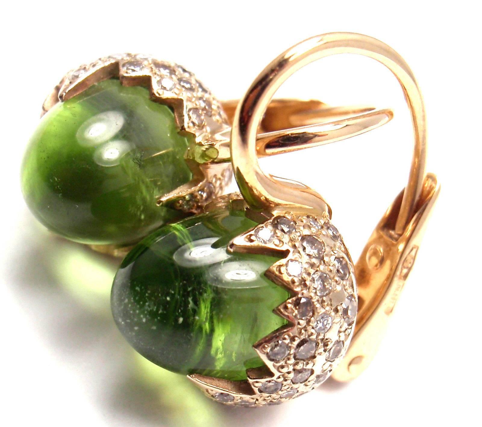 18k Rose & White Gold Peridot Diamond Chimera Earrings by Pomellato.
With 120 round brilliant cut diamonds VS1 clarity, G color total weight approx. .90ct
2 peridots

These earrings come with original Pomellato box and a