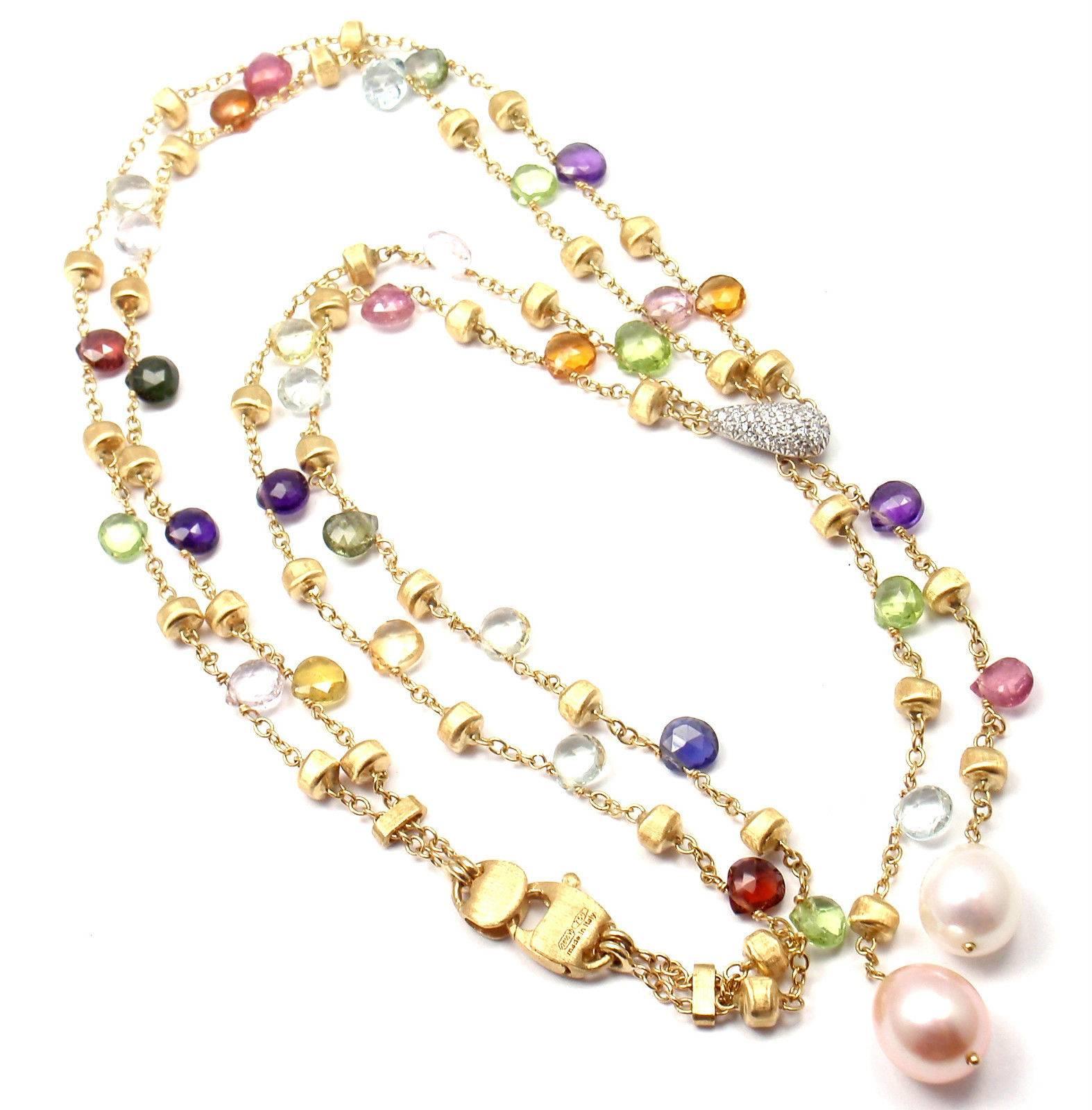 18k Yellow Gold Paradise Multicolor Gemstone Diamond Lariat Necklace by Marco Bicego.  
With Round brilliant cut diamonds total weigh approx. .30ct
Mixed semi-precious colored stone
2 cultured pearls 9mm x 10mm
This necklace is in mint condition