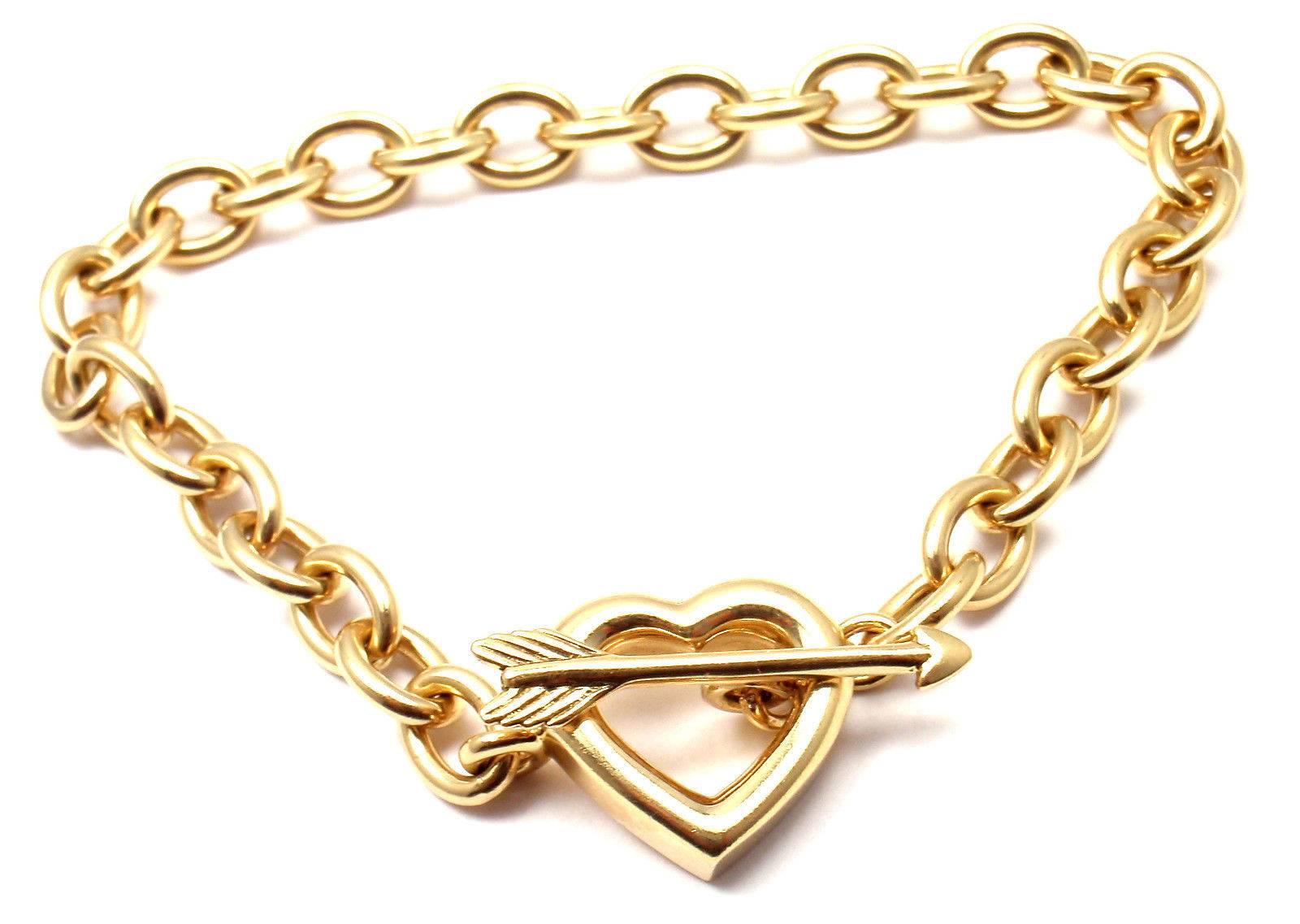 18k Yellow Gold Heart And Arrow Link Toggle Bracelet by Tiffany & Co. 

Details: 
Length: 7.5