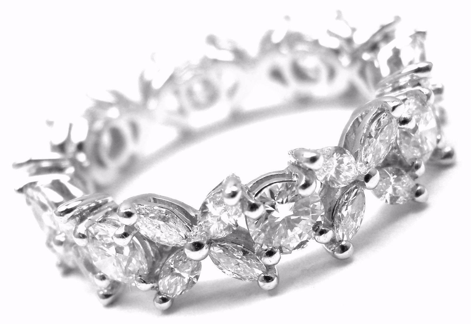 Platinum Victoria Diamond Eternity Band Ring by Tiffany & Co. 
With Marquise diamonds, carat total weight .79
Round brilliant diamonds, carat total weight 1.14
This ring comes with Tiffany & Co box.

Details: 
Size: 6.5
Weight: 5 grams
Width