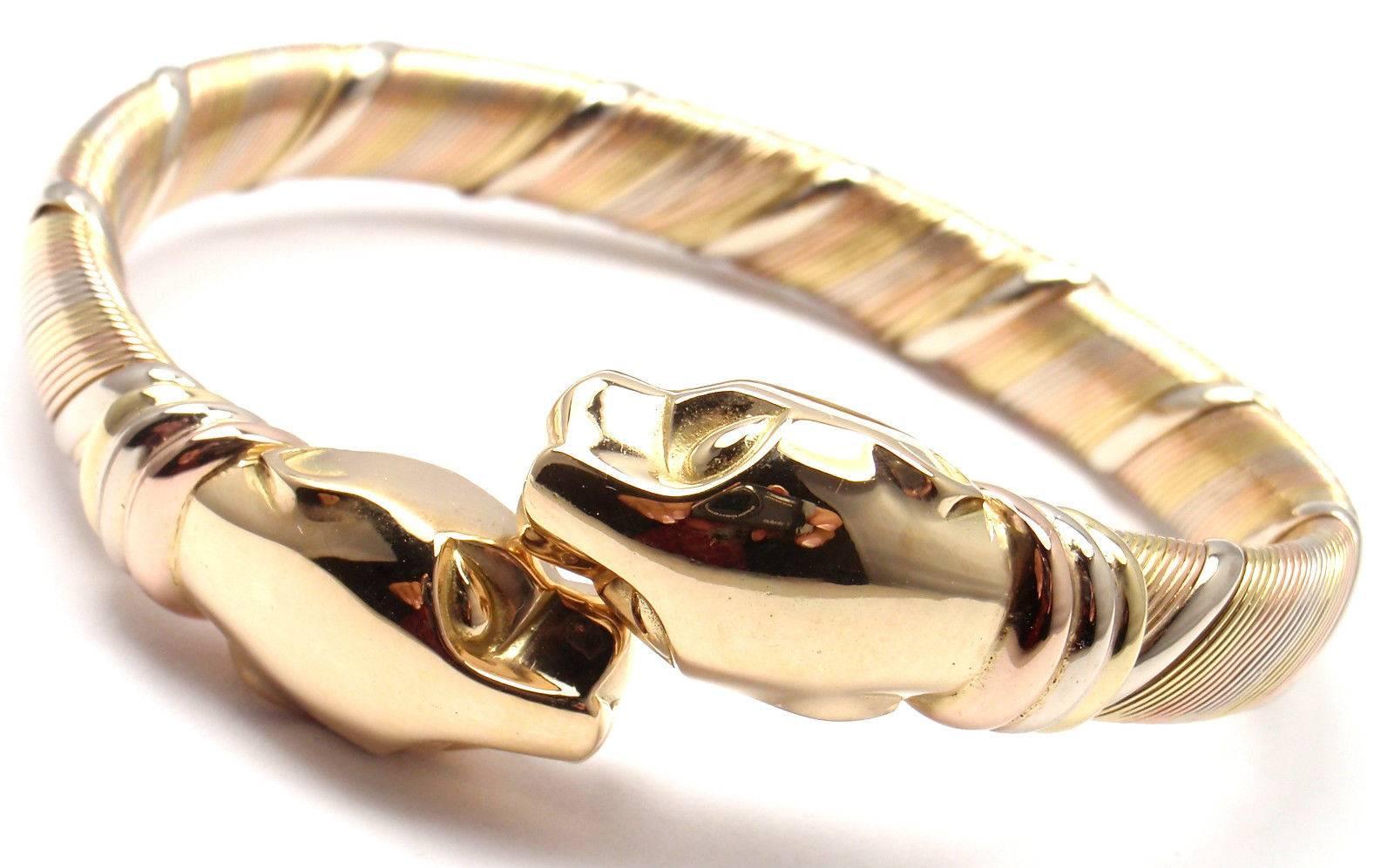 18k Tri-Color (Yellow, White, Pink) Gold Panther Bangle Bracelet by Cartier.
This beautiful bracelet comes with its original Cartier box.

Details:
Weight: 48.6 grams
Length: 7