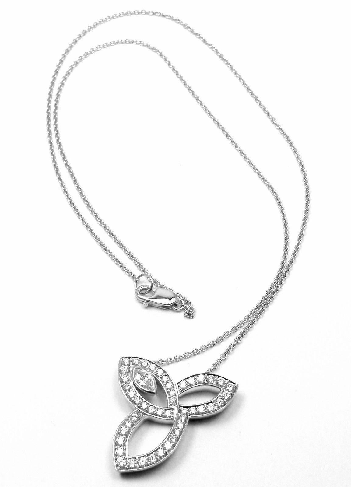 Platinum Diamond Lily Cluster Pendant Necklace by Harry Winston.  
With 1 marquise and 45 round brilliant diamonds weighing a total of approximately 0.67ct

Details: 
Weight: 11.6 grams 
Measurements: Chain: Length 16