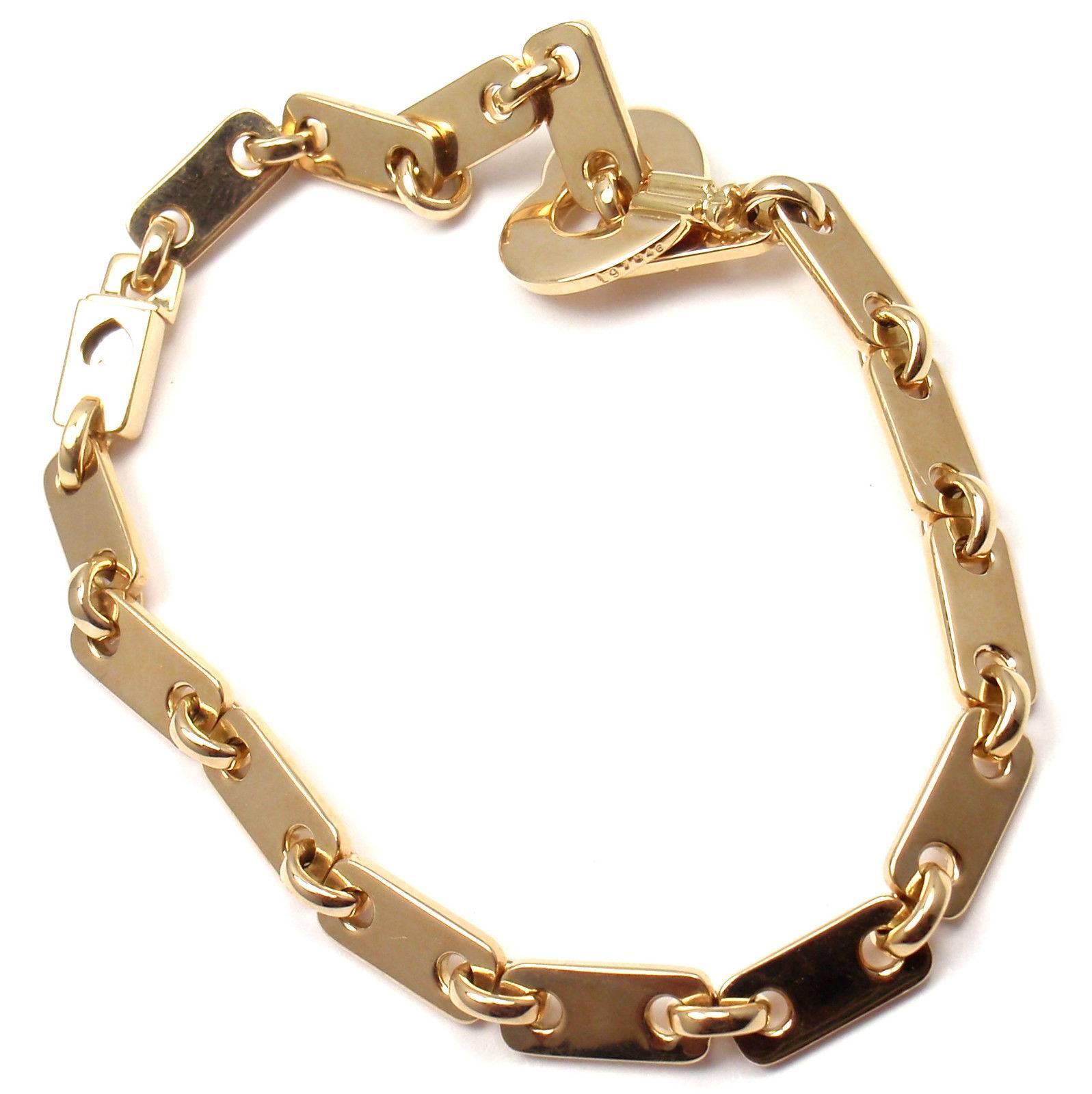 Cartier Gold Heart Lock Charm Link Bracelet In New Condition In Holland, PA