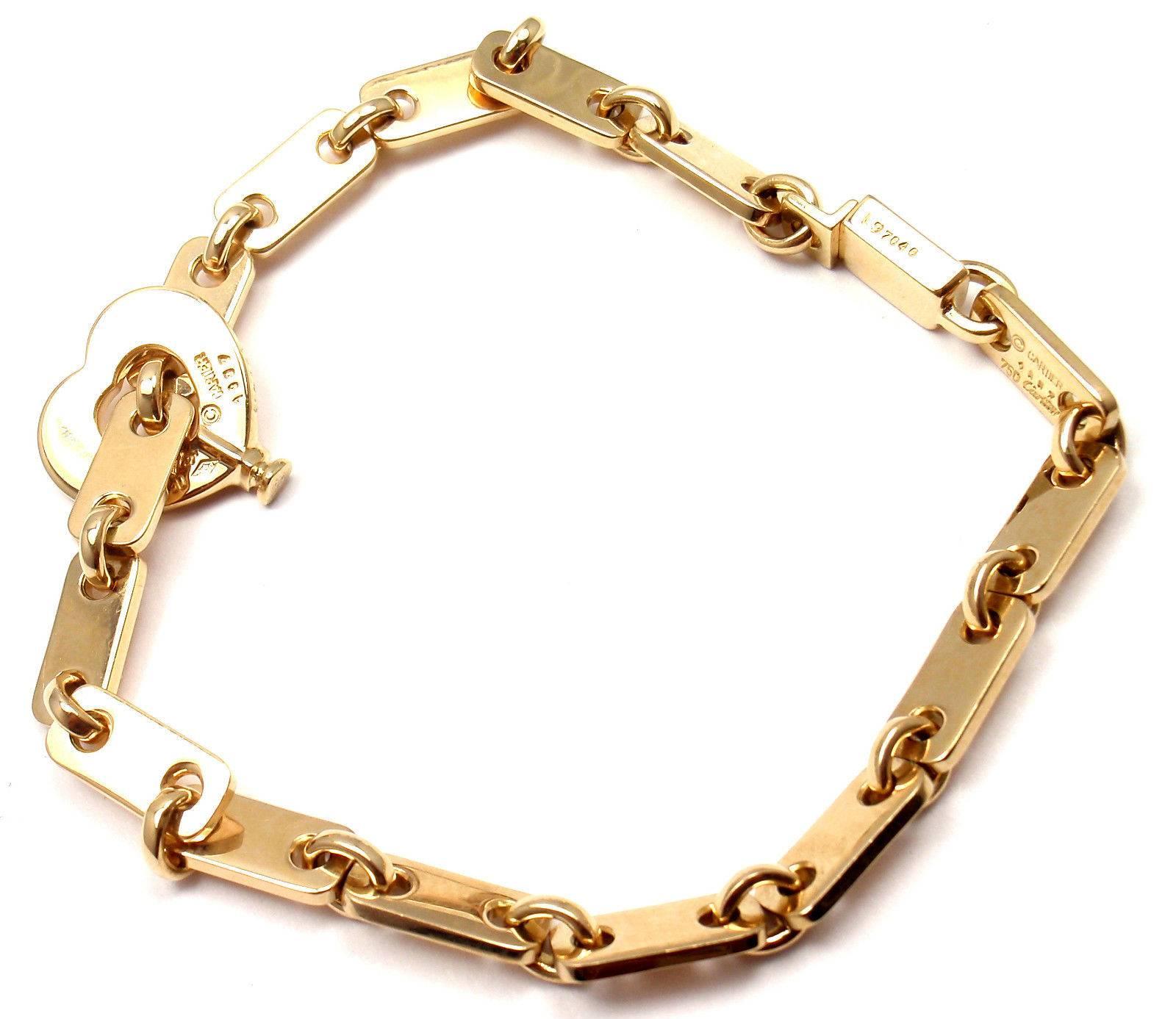 18k Yellow Gold Heart Lock Link Bracelet by Cartier. 

Measurements: 
Length: 7