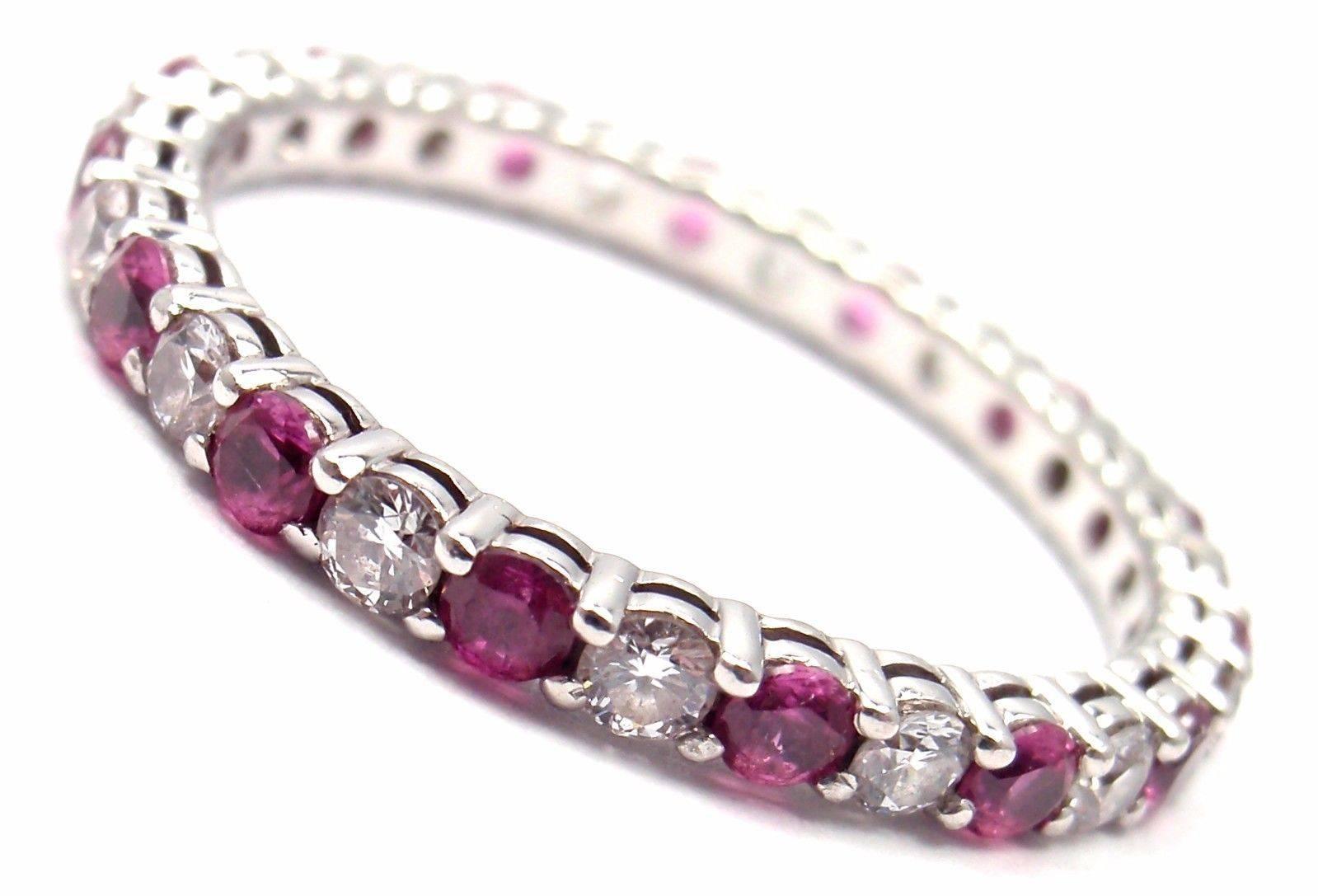Tiffany & Co Platinum Diamond And Pink Sapphire Shared Setting Band Ring.
With Round brilliant cut diamonds VS1 clarity, G color total weight approx. .42ct
Round pink sapphires .49ct

Measurements:
Ring Size: 6 3/4
Weight: 2.5 grams
Band