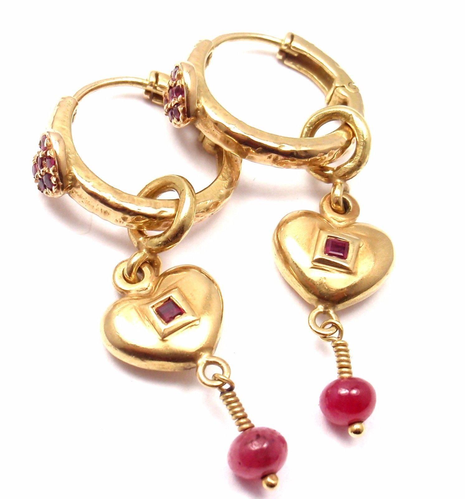 18k Yellow Gold Ruby Heart Enhancers Hoop Earrings by Loree Rodkin. 
With 14 round rubies

Details: 
Measurements: 42mm x 16mm
Weight: 11.4 grams
Stamped Hallmarks:  LR 18k

*Free Shipping within the United States*

YOUR PRICE: