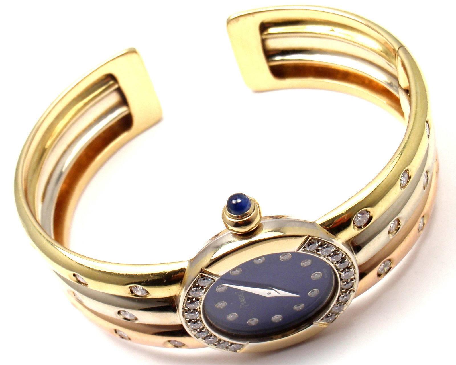 18k Tri-Color Gold Diamond Lapis Dial Bangle Bracelet Watch by Piaget.
With 46 round brilliant cut diamonds VS1 clarity, G color total weight approx. 1.5ct
This watch comes with Piaget box.

Details:
Movement Type:  Mechanical Manual Wind
Case