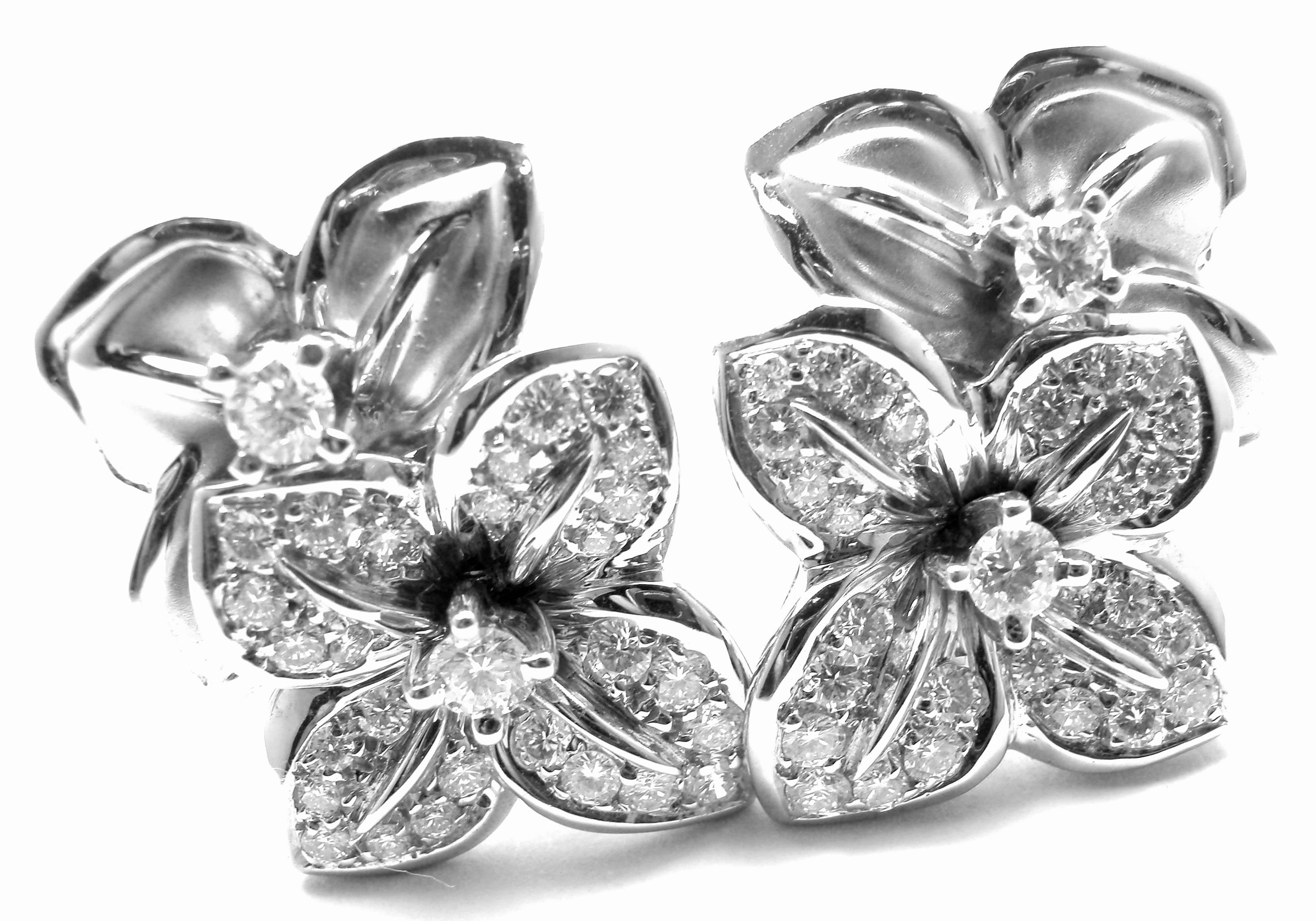 18k White Gold Diamond Flower by Mikimoto. 
With 58 round brilliant cut diamonds VVS1 clarity, E color total weight approx. 1.5ct
These earrings come with Mikimoto box.
***These earrings are for pierced ears.

Details: 
Measurements: 1