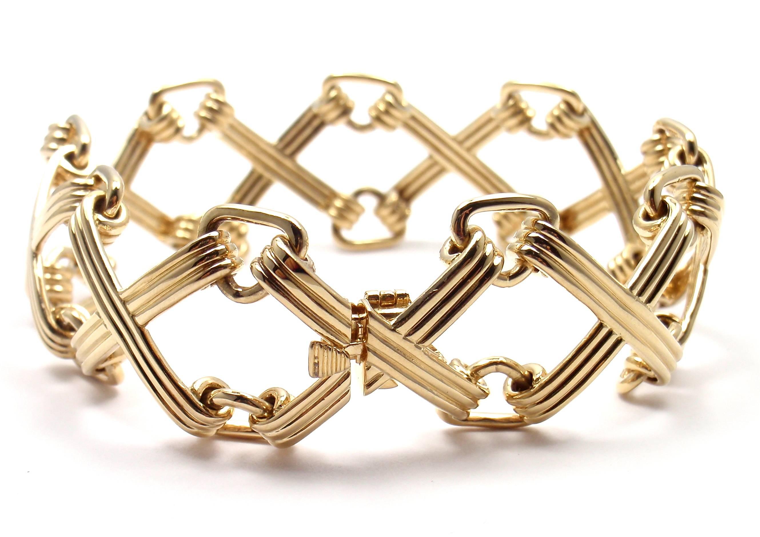 18k Yellow Gold X and Triangle Link Bracelet by Jean Schlumberger 
for Tiffany & Co.

Measurements: 
Length: 7
