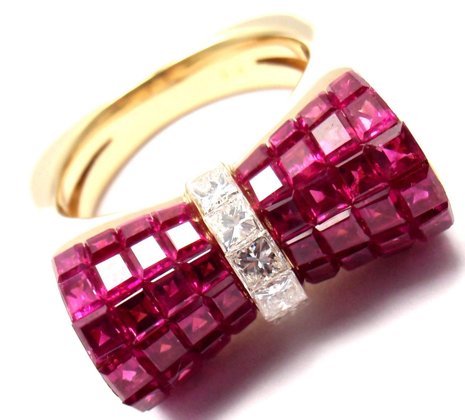 Gorgeous! Estate Yellow Gold Ruby And Diamond Invisible Setting Bow Ring.
With Princess cut diamonds VS1 clarity, G color total weight approx. .57ct
Rubies total weight approx. 7.92ct

Details: 
Weight: 13.1 grams
Size: 7
Width: 10mm
Stamped