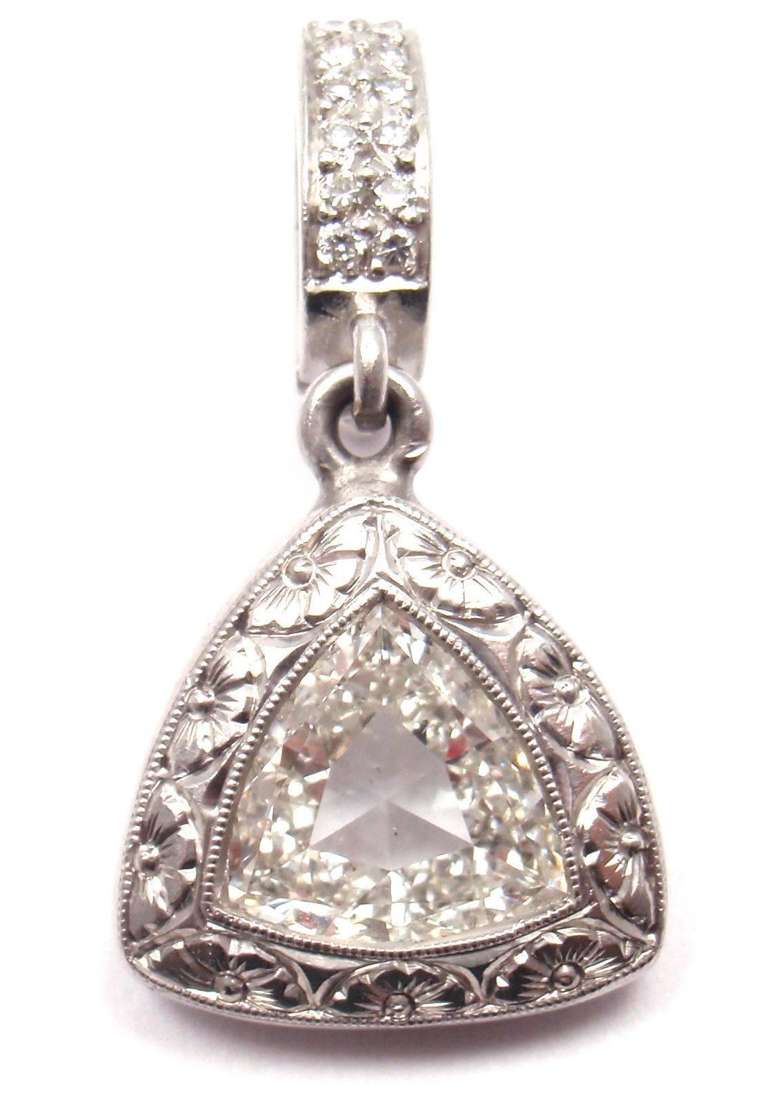 Platinum 2.30ct Center Tringle Shape Diamond Enhancer Pendant 
by Loree Rodkin.
With 1 Triangle shape large diamond SI1 clarity, H-I color total weight  
                           approx. 2.30ct and 14 round diamonds.

Details:
Measurements: