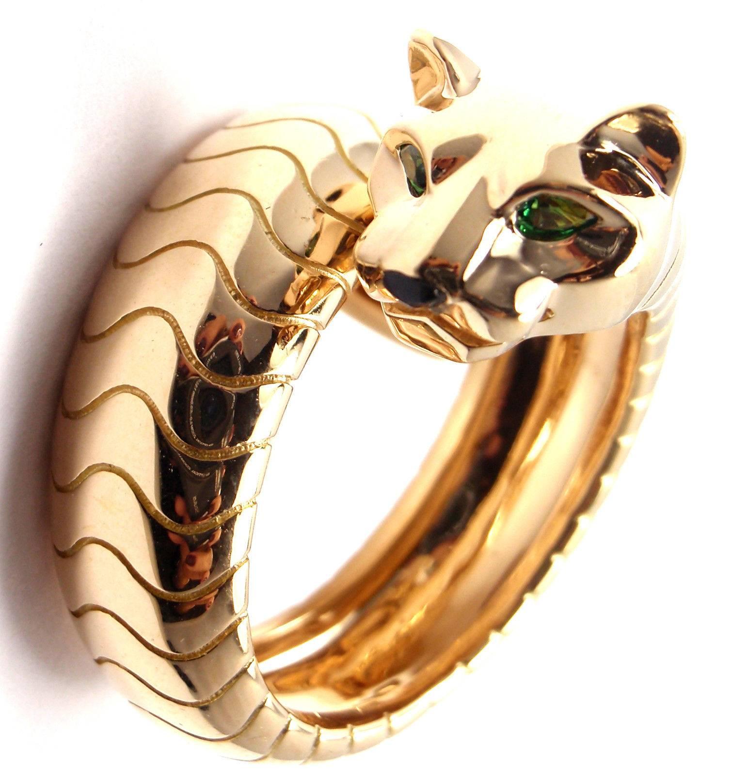 18k Yellow Gold Tsavorite Garnet and Onyx Panther Ring by Cartier. 
Part of the 