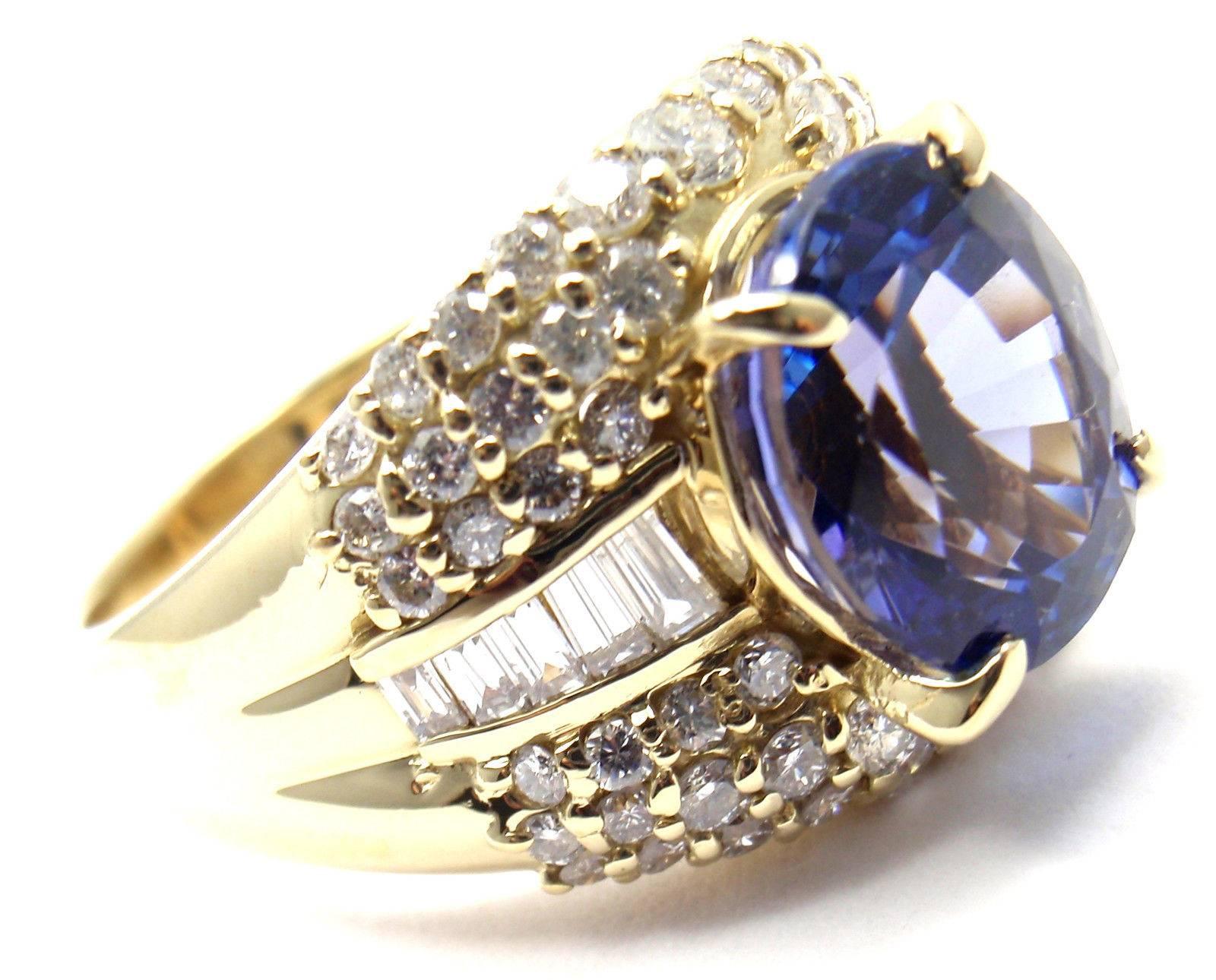 Gorgeous! Estate Yellow Gold Large 3.87ct Tanzanite And Diamond Cocktail Ring.
With 1 oval tanzanite 3.87ct
Diamonds SI1 clarity, G color total weight approx. 1.11ct

Details: 
Weight: 9.1 grams
Size: 6.5
Width: 14mm
Stamped Hallmarks: 18k