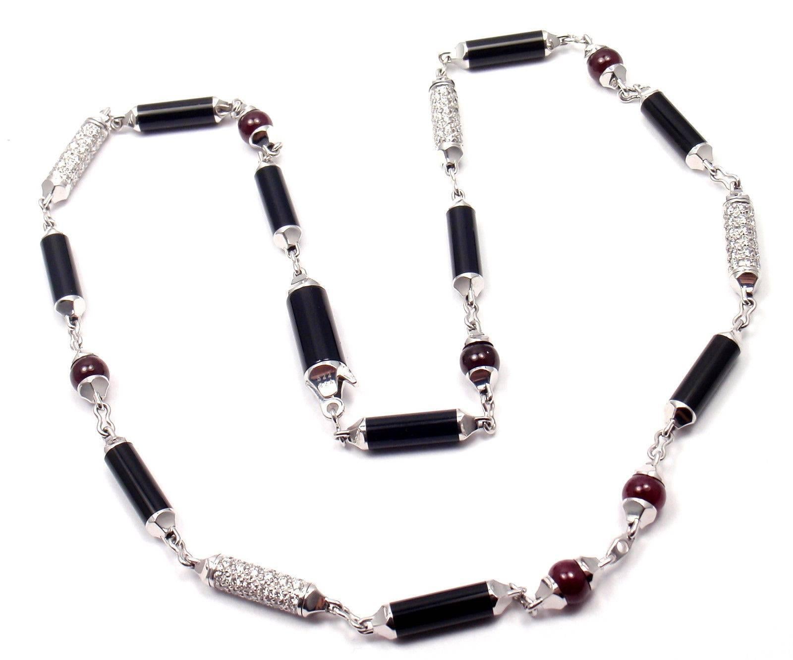 18k White Gold Diamond Black Onyx Ruby Necklace by Cartier. Part of Cartier's 
