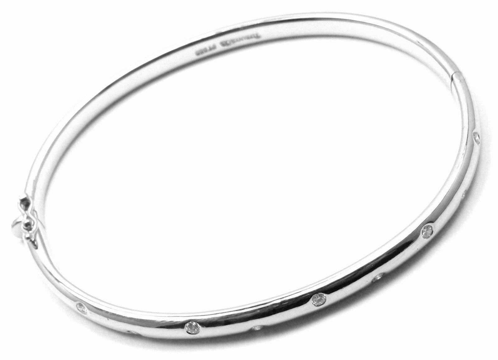 Platinum Diamond Etiole Bangle Bracelet by Tiffany & Co.  
With 10 round brilliant cut diamonds VS1 clarity, E color total weight 
approx. .30ct

Details:  
Weight: 36.3 grams
Length: 6 3/4