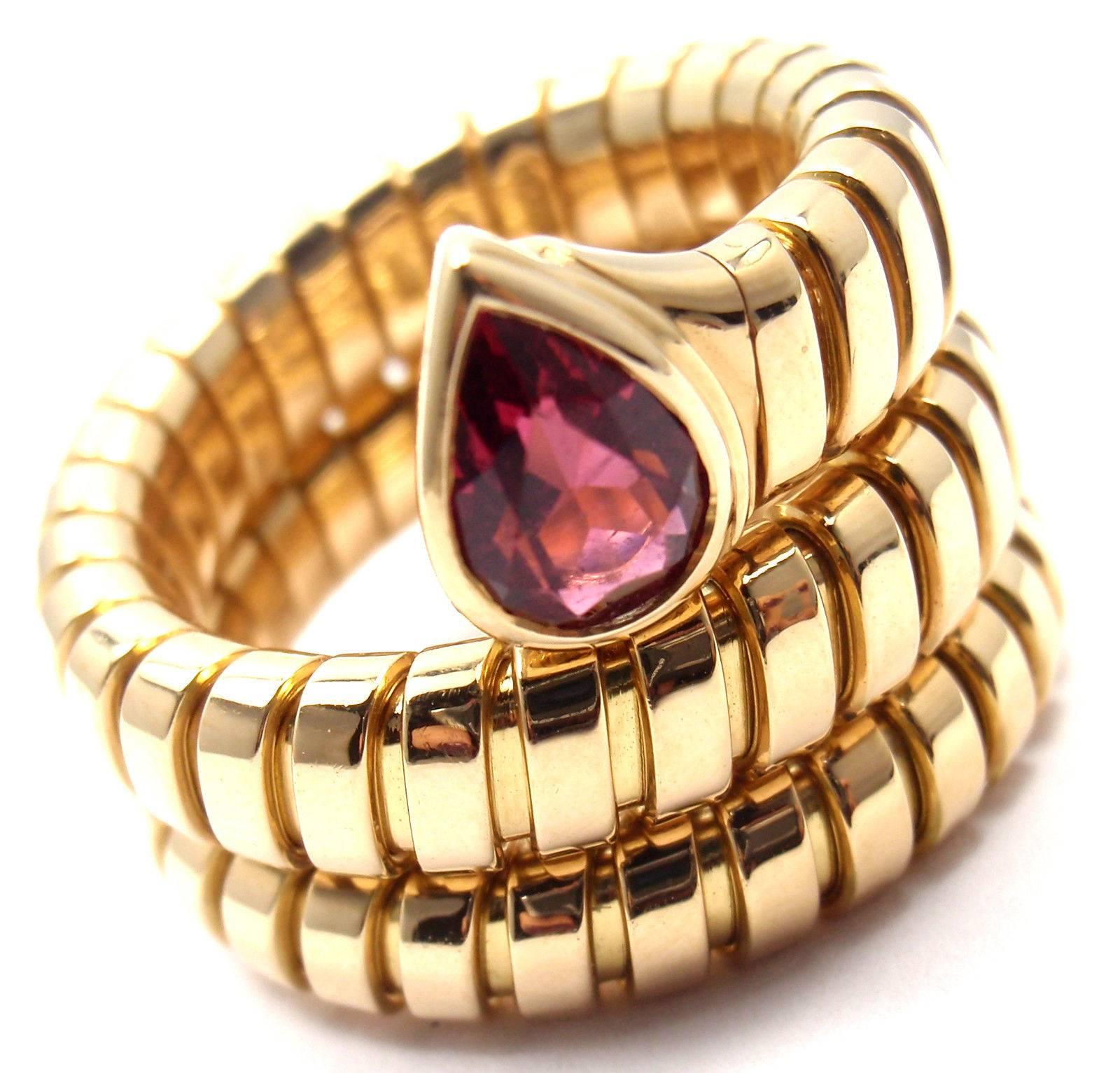 18k Yellow Gold Ruby Coil Snake Ring by Bulgari. 
With One Pear-Shaped Ruby Stone: 6mm x 4mm.

Details:
Ring Size: 5-6 (the ring stretches)
Width: 18mm
Weight: 17.1 grams
Stamped Hallmarks:  Bulgari, 750, 2337AL

*Free Shipping within the