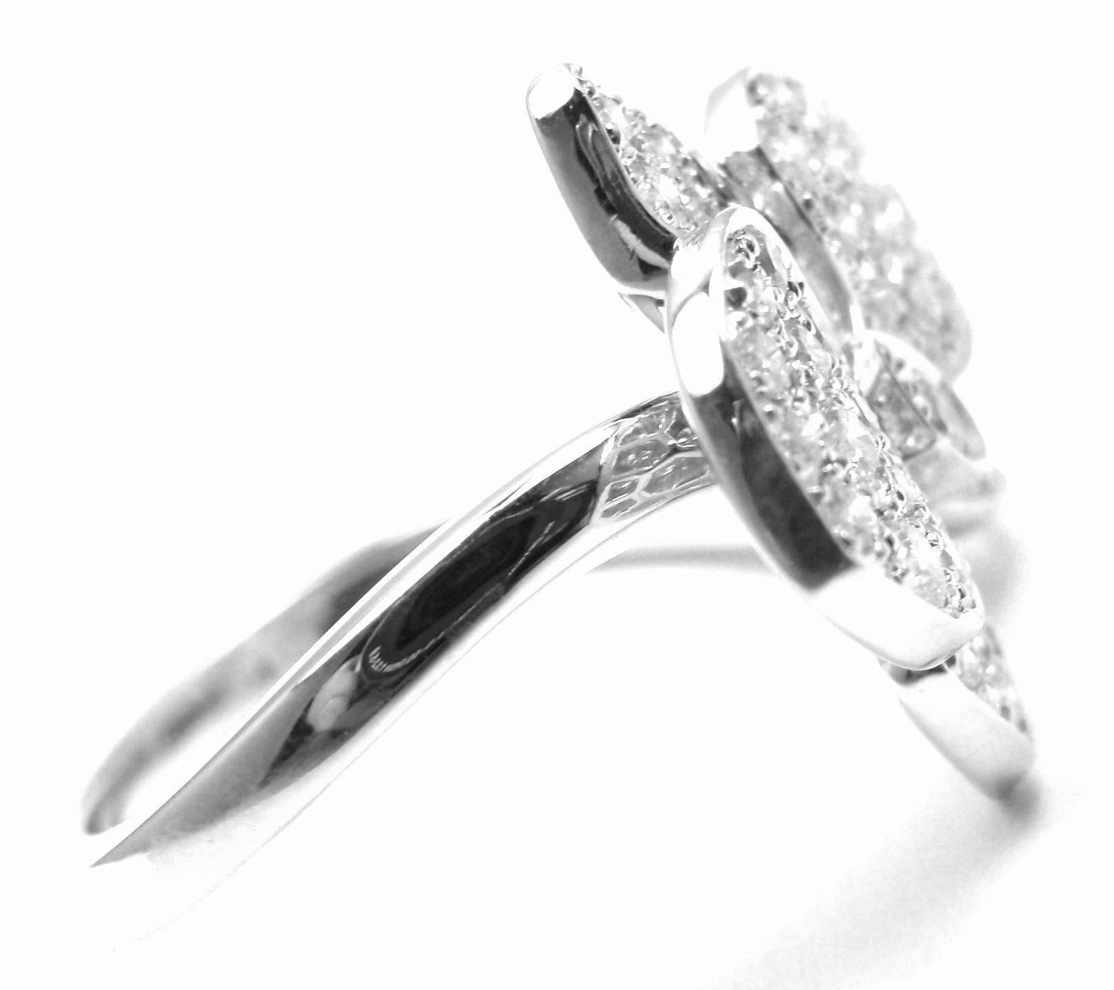 18k White Gold Caresse D'orchidées Orchid Flower Diamond Ring by Cartier.   
With 49 round brilliant cut diamonds VS1 clarity, E color total weight approx. .54ct
This ring comes with its original Cartier box.  
Details: 
Ring Size: European 52, US