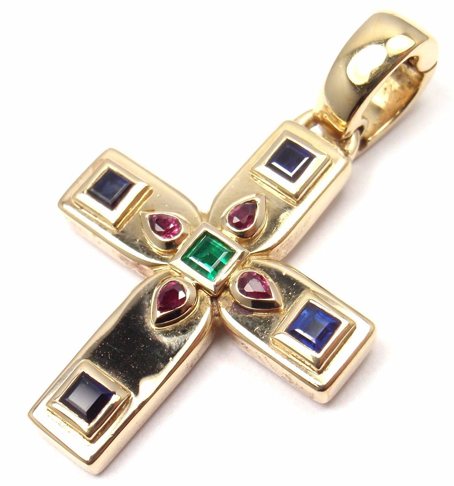 18k Yellow Gold Vizantija Cross Sapphire, Ruby, and Emerald Pendant by Cartier. 

Stones: 
a. 4 Princess Cut Sapphires, Total Weight: .16ct
b. 4 Pear Shape Rubies, Total Weight: .06ct
c. 1 Emerald, .04ct

Details: 
Measurements:	30mm x