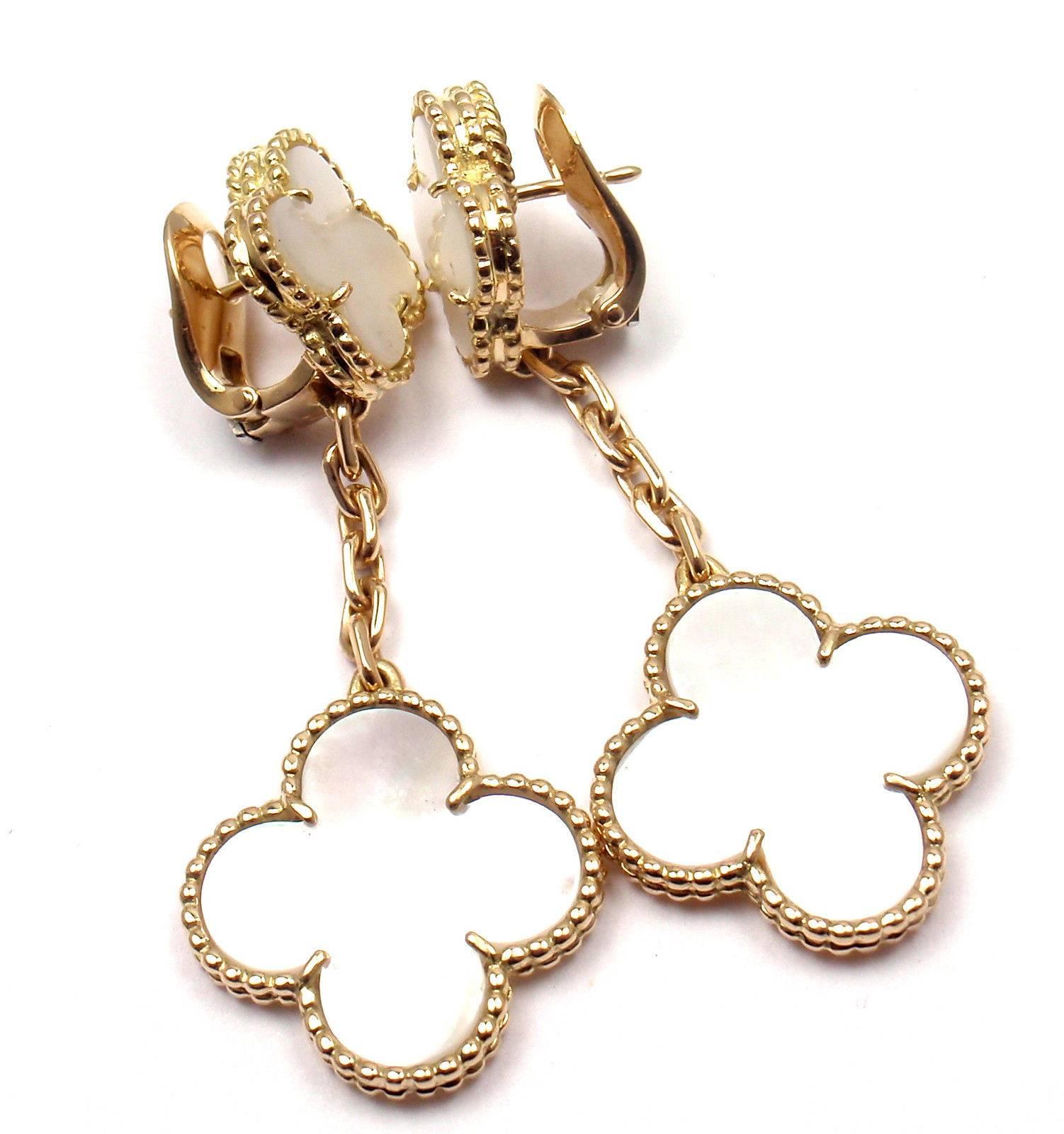 18k Yellow Gold Magic White Mother Of Pearl Alhambra Long Earrings by Van Cleef & Arpels.  
With 2 motifs of white mother of pearl alhambra stones 15mm each 2 motifs of white mother of pearl alhambra stones 20mm each  
These earrings come with Van