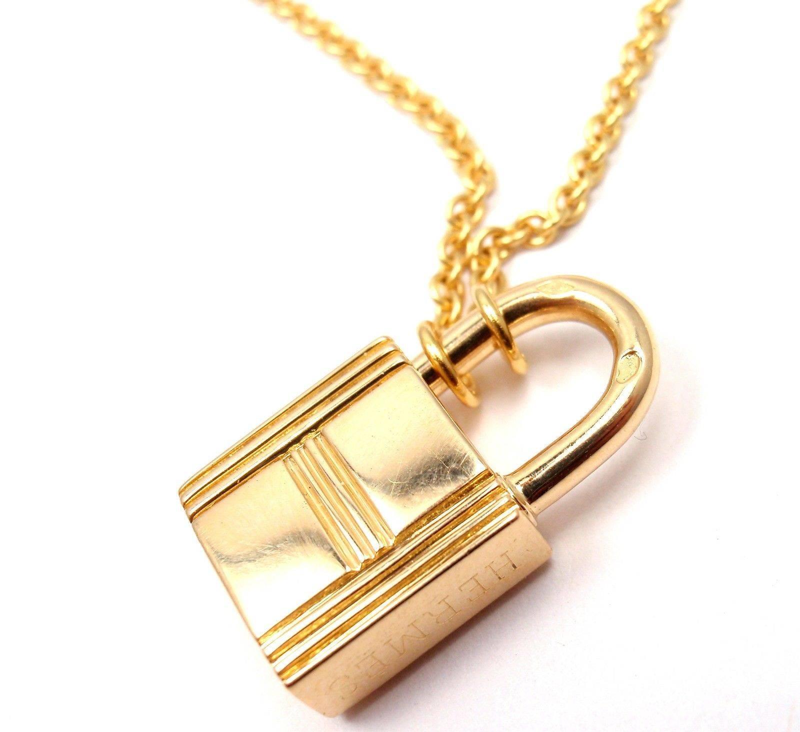 18k Yellow Gold Lock Pendant Charm Chain Necklace by Hermes. 

Details: 
Weight: 16.8 grams
Pendant Size: 11.5mm x 21mm x 6mm
Necklace Length: 17"
Stamped Hallmarks: Hermes AU 750 French Hallmark 
*Free Shipping within the United