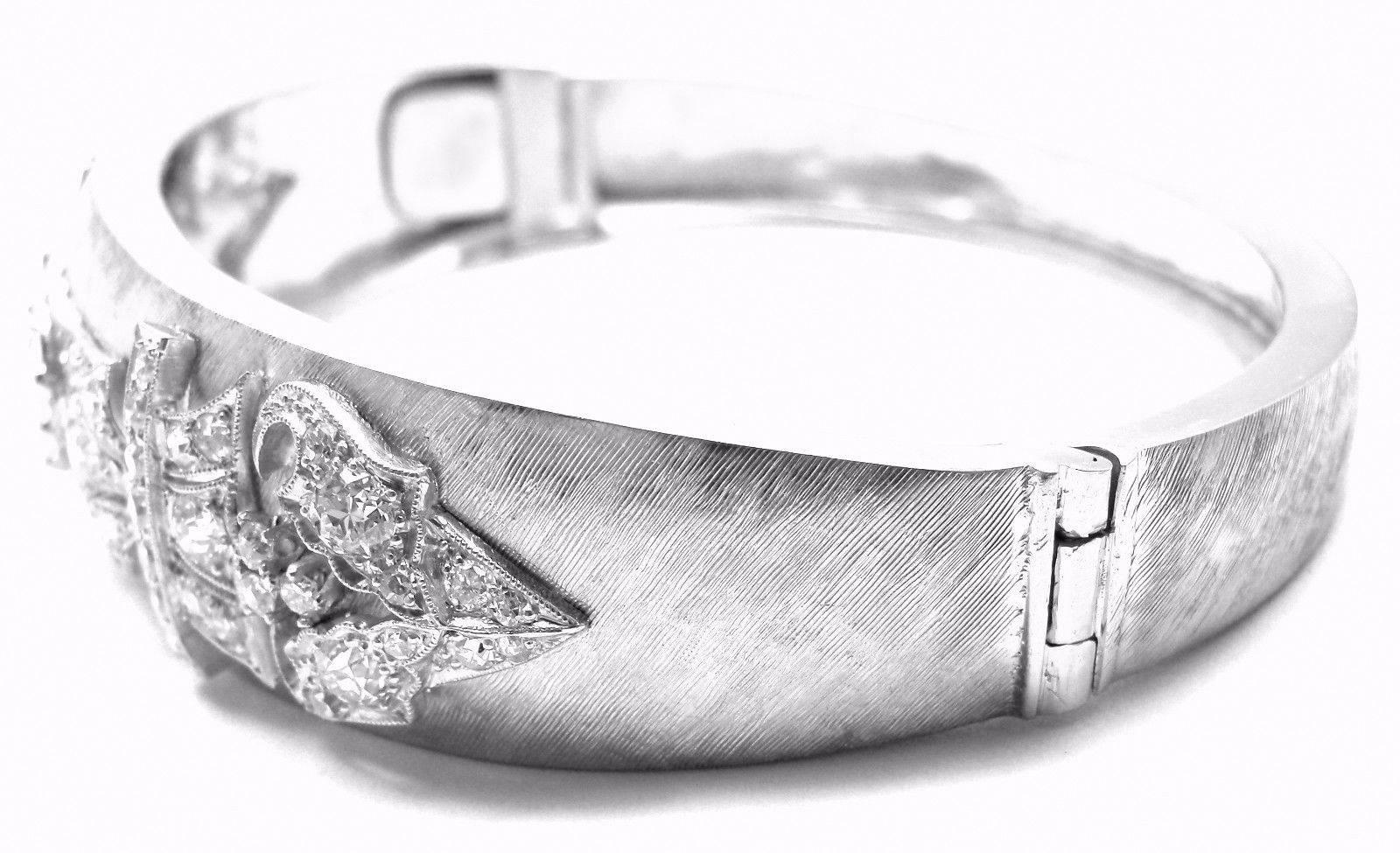 14k White Gold 3ct Diamond Bangle Bracelet.
With 1 round old European cut diamond 
70 round old miner cut diamonds total weight approx. 2ct
Diamonds are H-I color VS1 - VS2 clarity

Measurements:
Length: 7 3/4"
Width: 17mm
Weight: 34.8