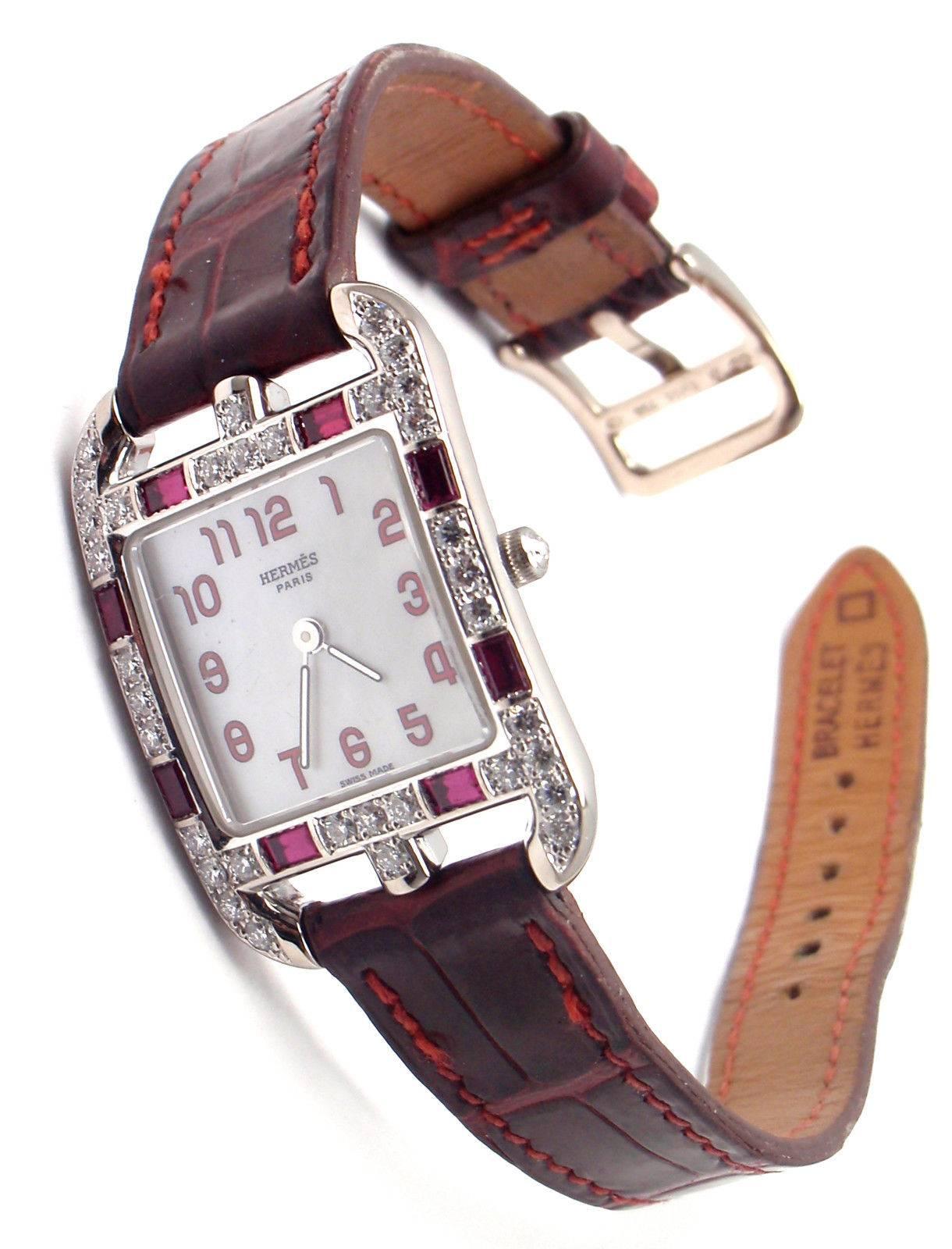 18k white gold diamond and rubies Cape Cod watch by Hermes. 
With round brilliant cut diamonds and rubies on the case.
Watch is in excellent with no fading, scratching, or rubbing.

Details: 
Case Dimensions:  23mm x 34mm x 7mm
Movement: