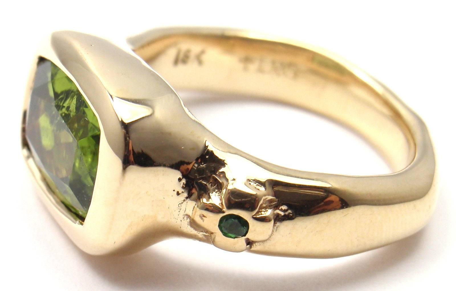 18k Yellow Gold Peridot Tsavorite Ring by Loree Rodkin. 
With 1 Peridot 7mm x 10mm and 2 small tsavorite stones.

Details: 
Size: 7
Weight: 14.2 grams
Width: 11mm
Stamped Hallmarks: LRG 18k
*Free Shipping within the United States*

YOUR