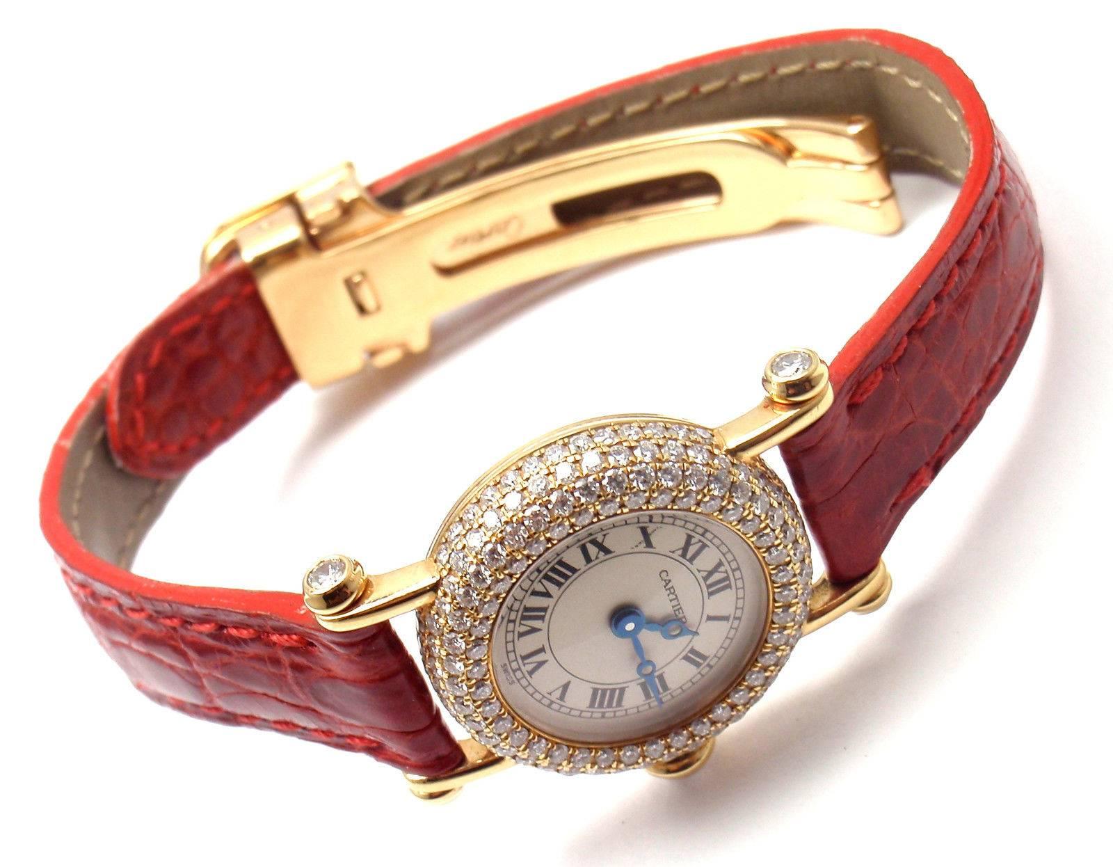 18k Yellow Gold Diamond Diabolo Ladies Wristwatch by Cartier. 
This gorgeous watch comes with original Cartier box.

Brand: Cartier
Style Number: Diabolo
Series: Mini 
Case Material: 18k Yellow Gold with Diamonds
Dial Color: Off white with Roman