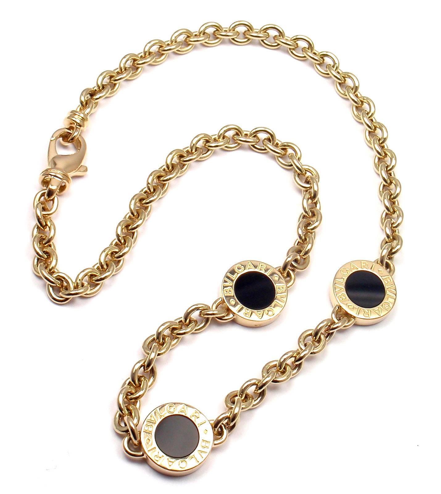 18k Yellow Gold Three Onyx Pendants Link Necklace by Bulgari.  
With 3 round black onyx stones 8mm each.
  
Details: 
Weight: 30.7 grams
Length: 15.5