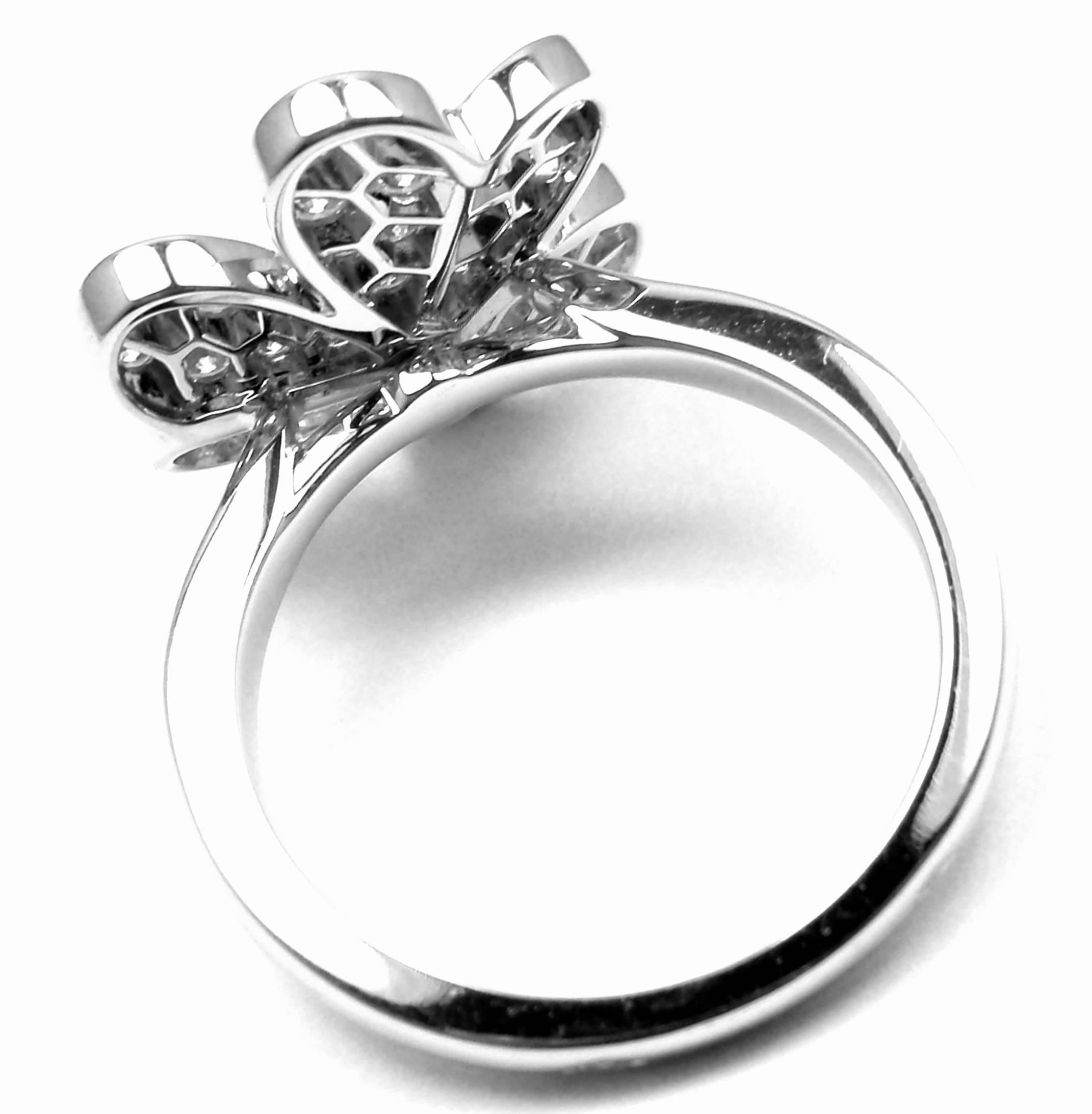 18k White Gold Frivole Diamond Flower Ring by  Van Cleef & Arpels.  
With 43 brilliant round cut diamonds VVS1 clarity, E color
Total weight .80ct
This ring comes with Van Cleef & Arpels certificate and a box.

Details: 
Weight: 5.7 grams 
Size: 51